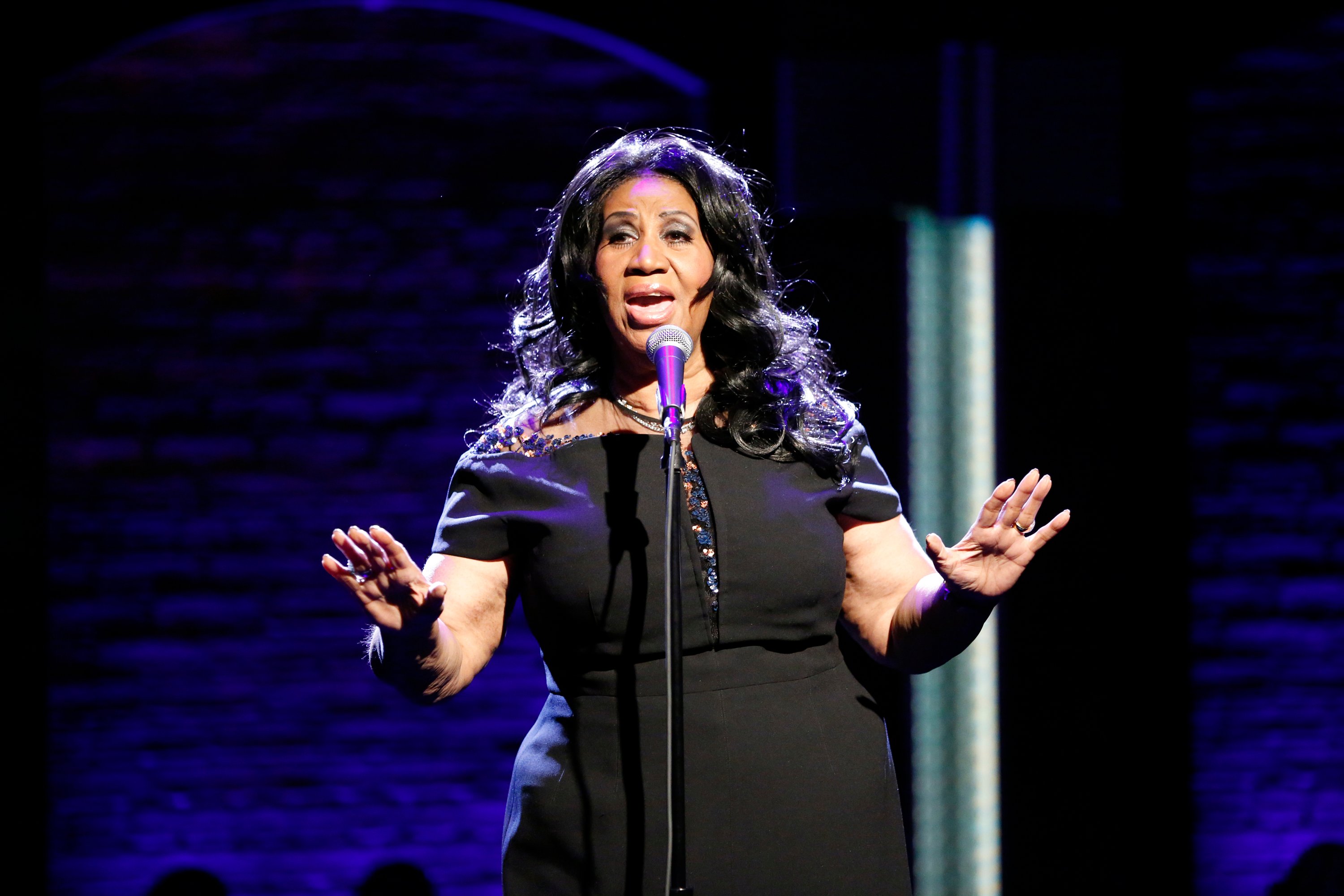Aretha Franklin performing onstage during an appearance on Late Night With Seth Meyers