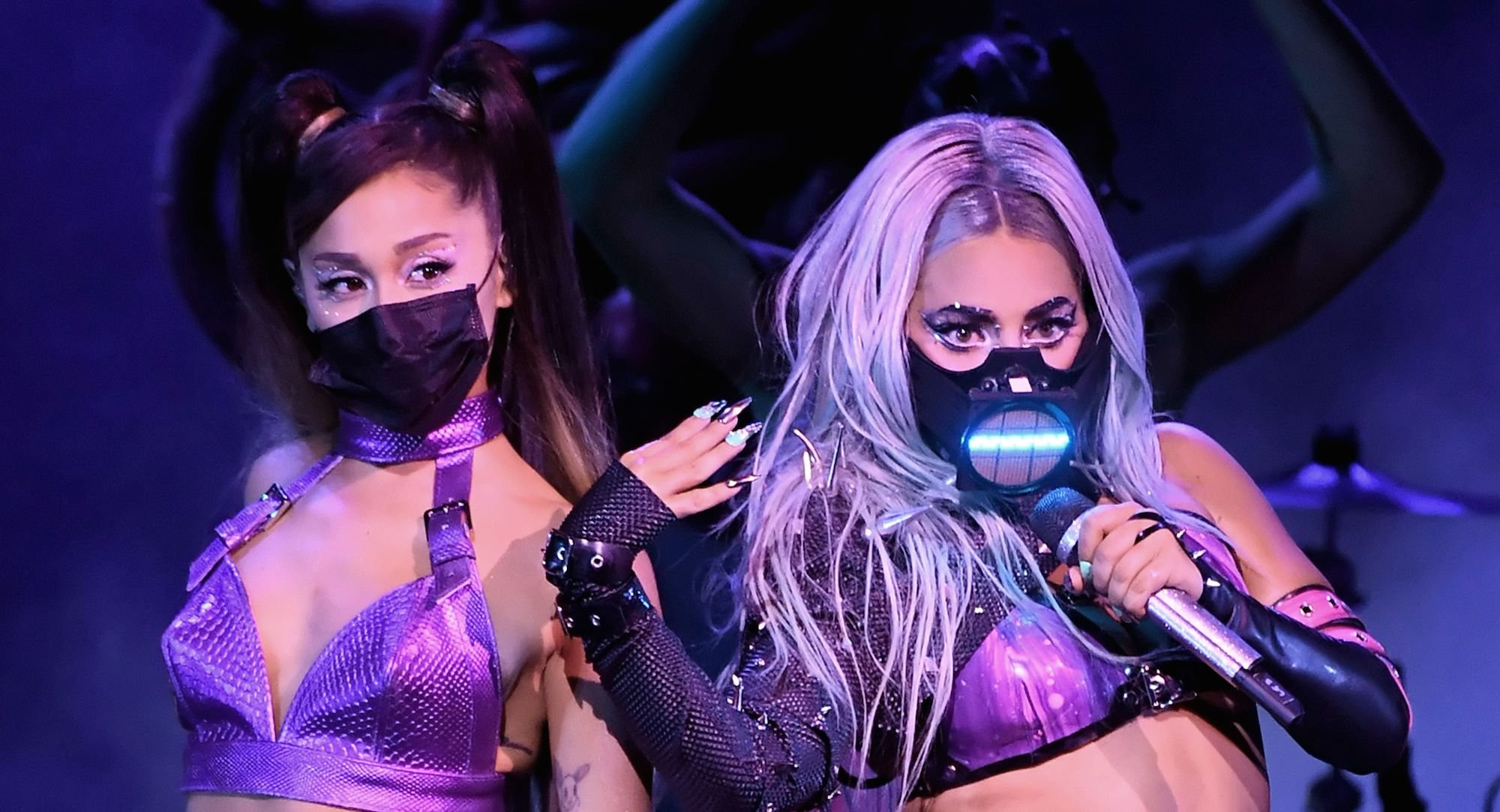(L-R) Ariana Grande and Lady Gaga in masks on stage performing during the 2020 MTV Video Music Awards