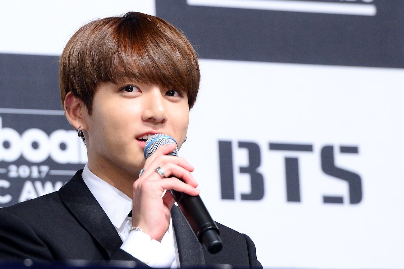 BTS's Jungkook speaking into a microphone