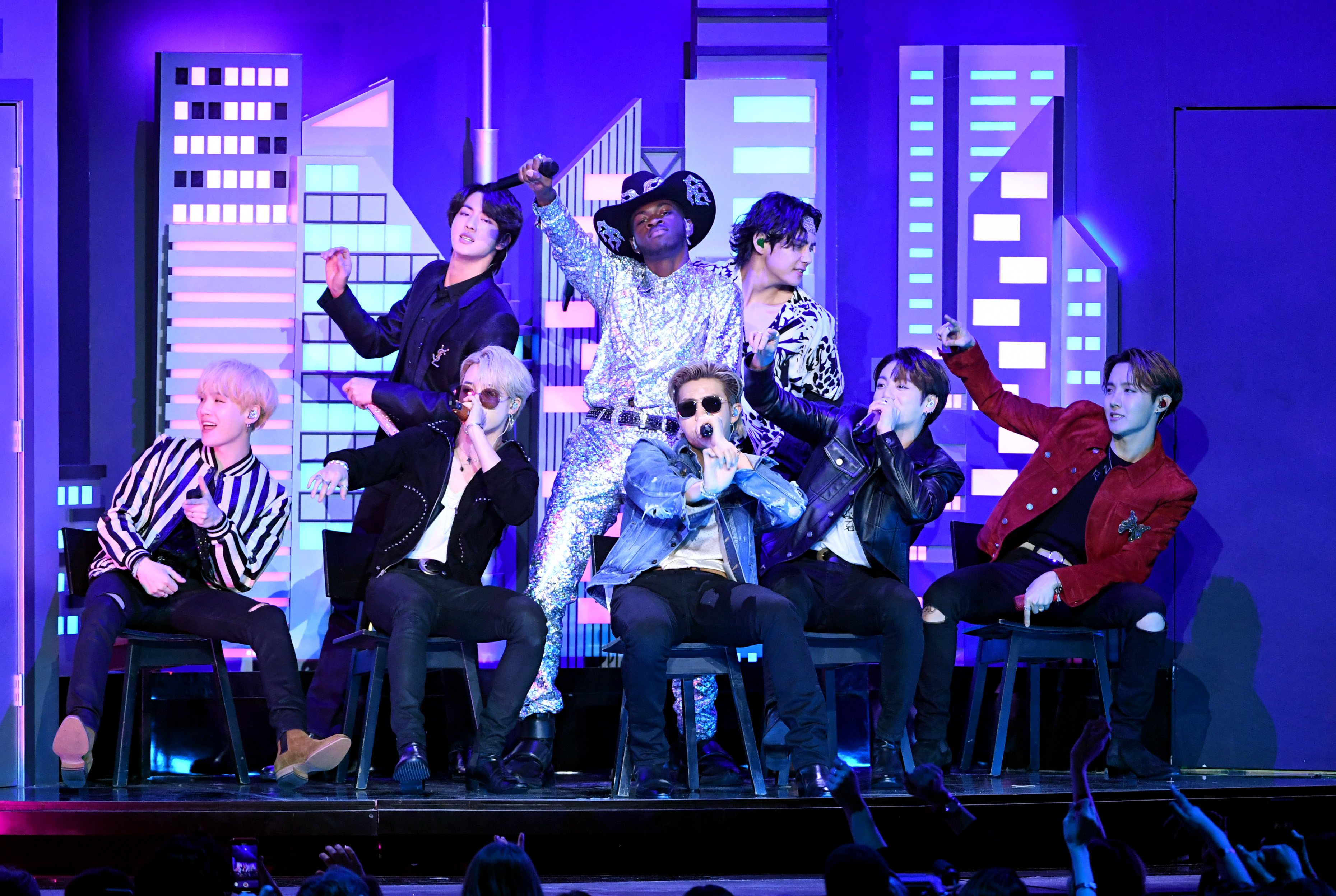 Lil Nas X and BTS perform on stage during the 62nd Annual Grammy Awards