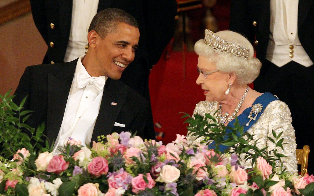 Barack Obama and Queen Elizabeth talking to each other at a state dinner