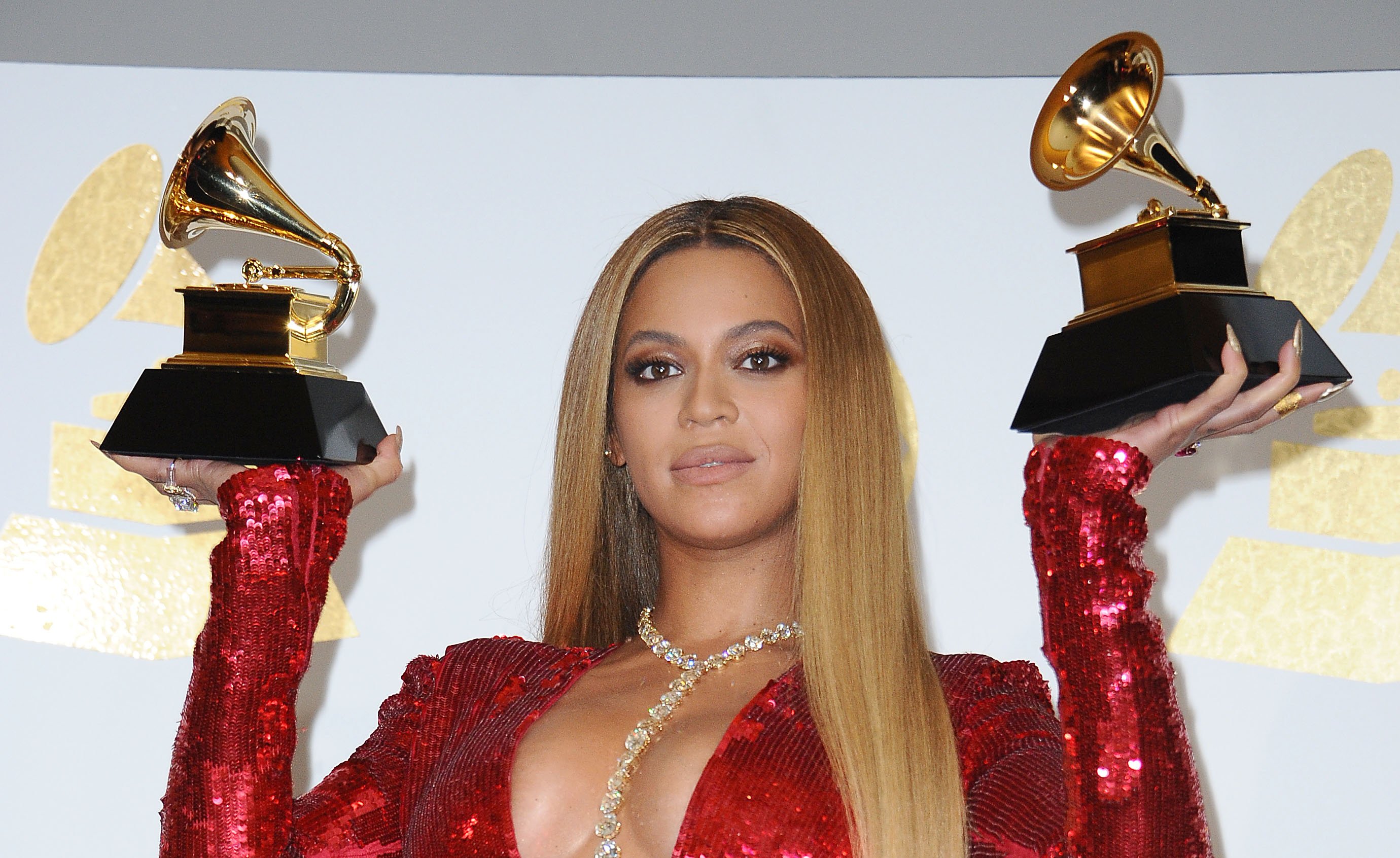 Beyoncé holding two Grammys