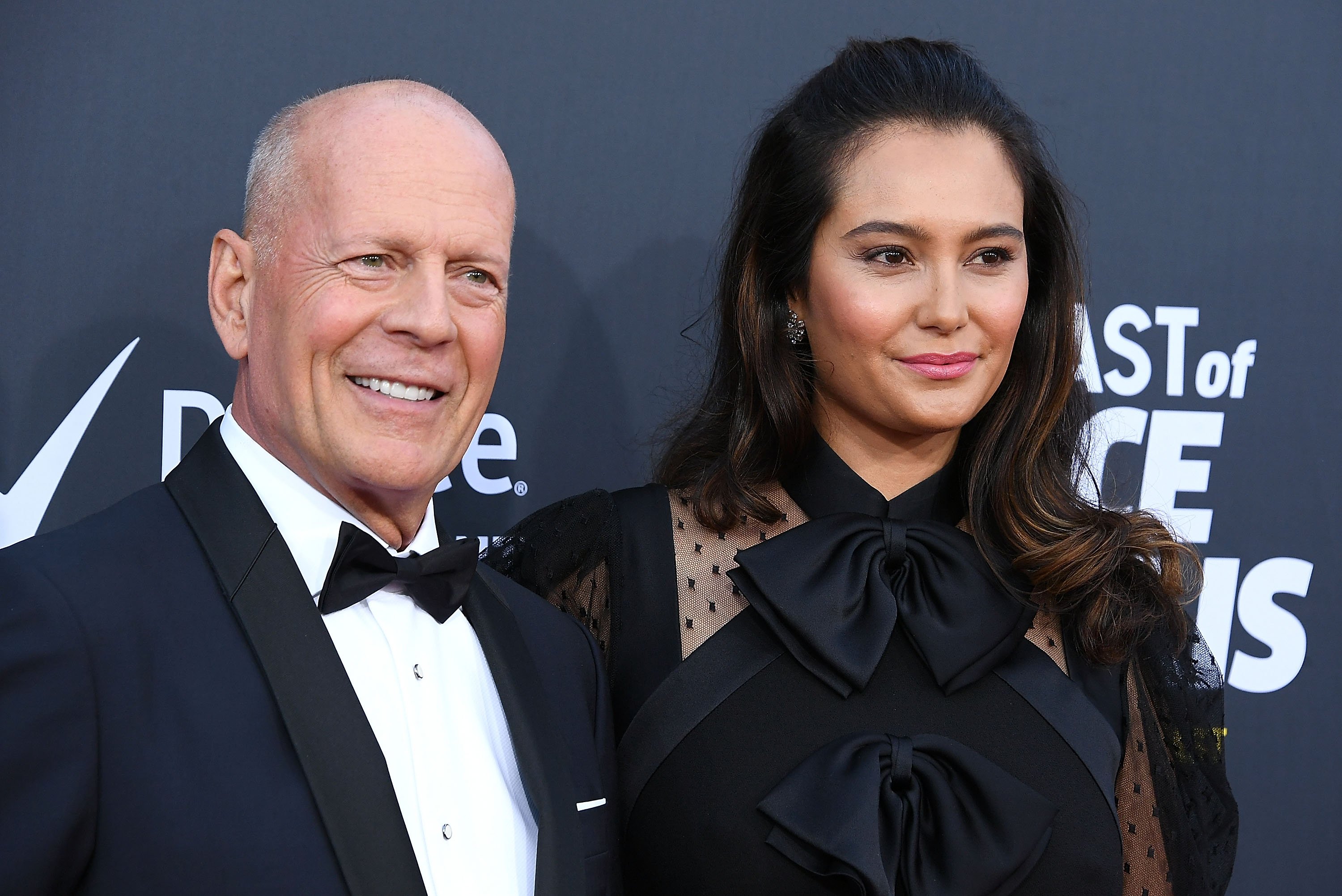 Bruce Willis and his wife, Emma Heming, pose together as they arrives at the Comedy Central Roast of Bruce Willis
