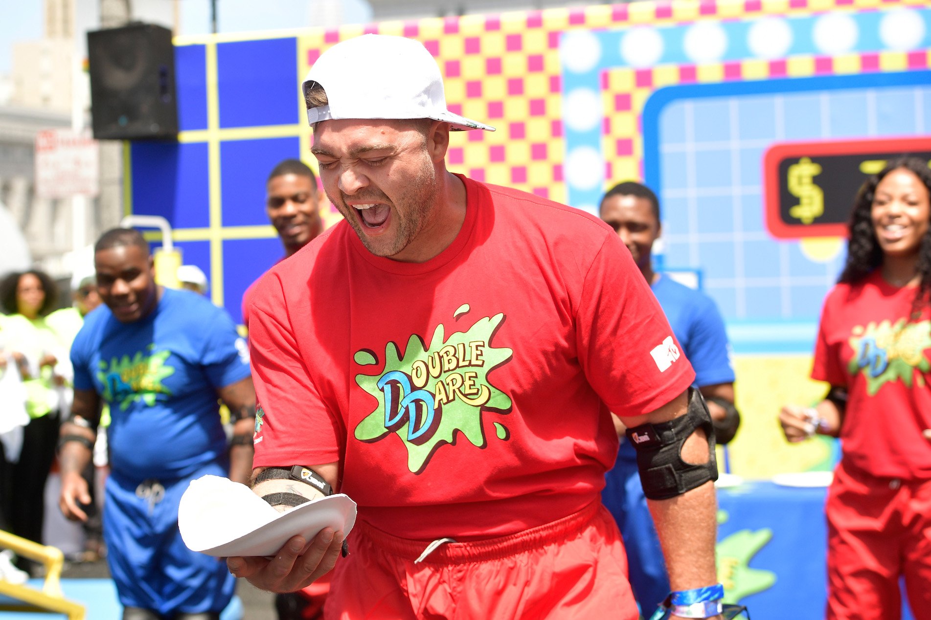 C.T. Tamburello from MTV's 'The Challenge' yelling and holding a paper plate of whipped cream at Comedy Central event