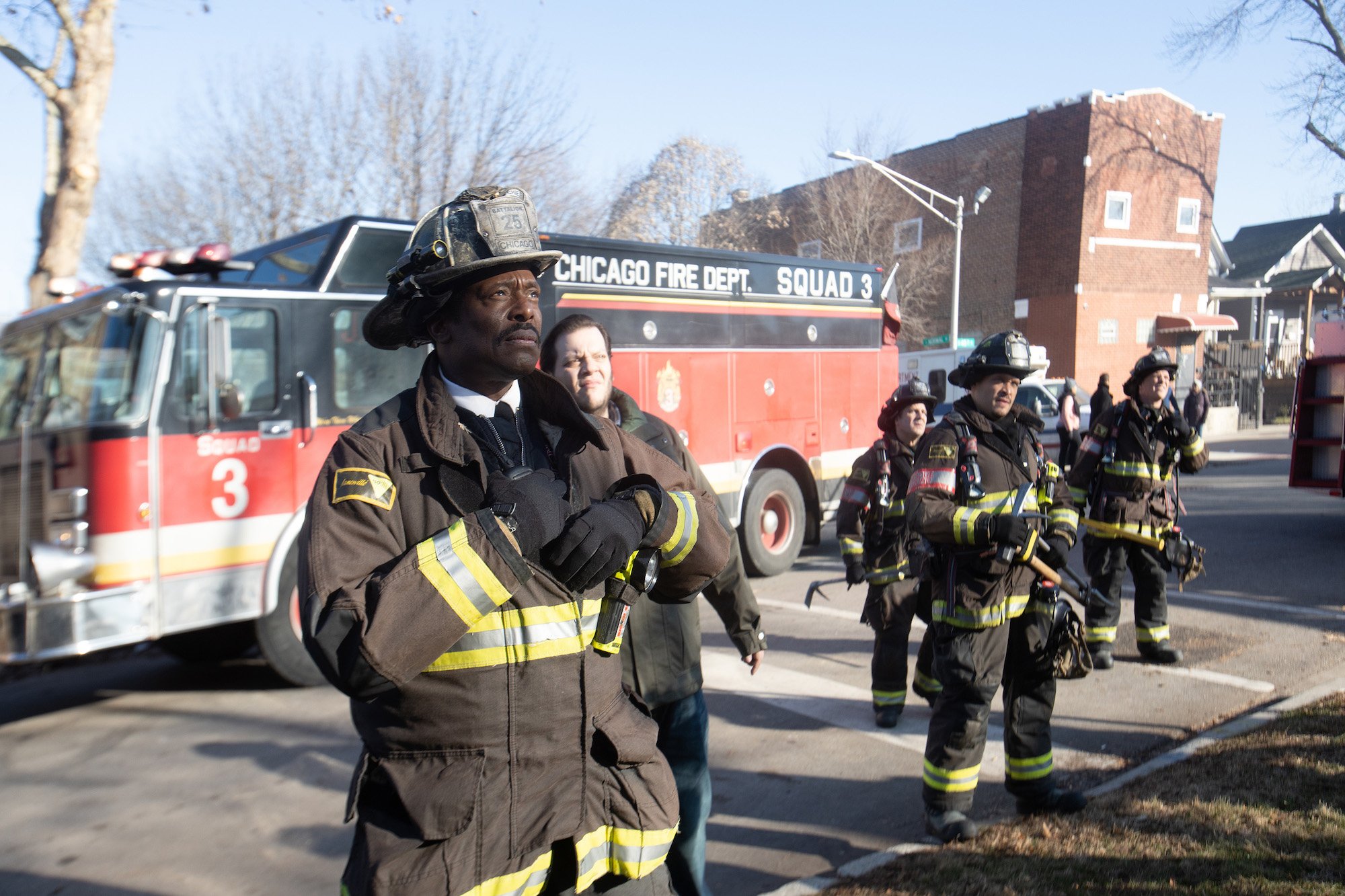 (L-R) Eamonn Walker as Wallace Boden, Joe Minoso as Joe Cruz in front of a fire truck