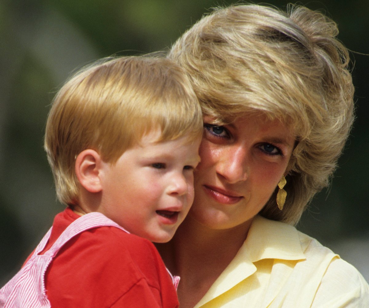 Diana, Princess of Wales holds young Prince Harry on August 10, 1987 | Georges De Keerle/Getty Images