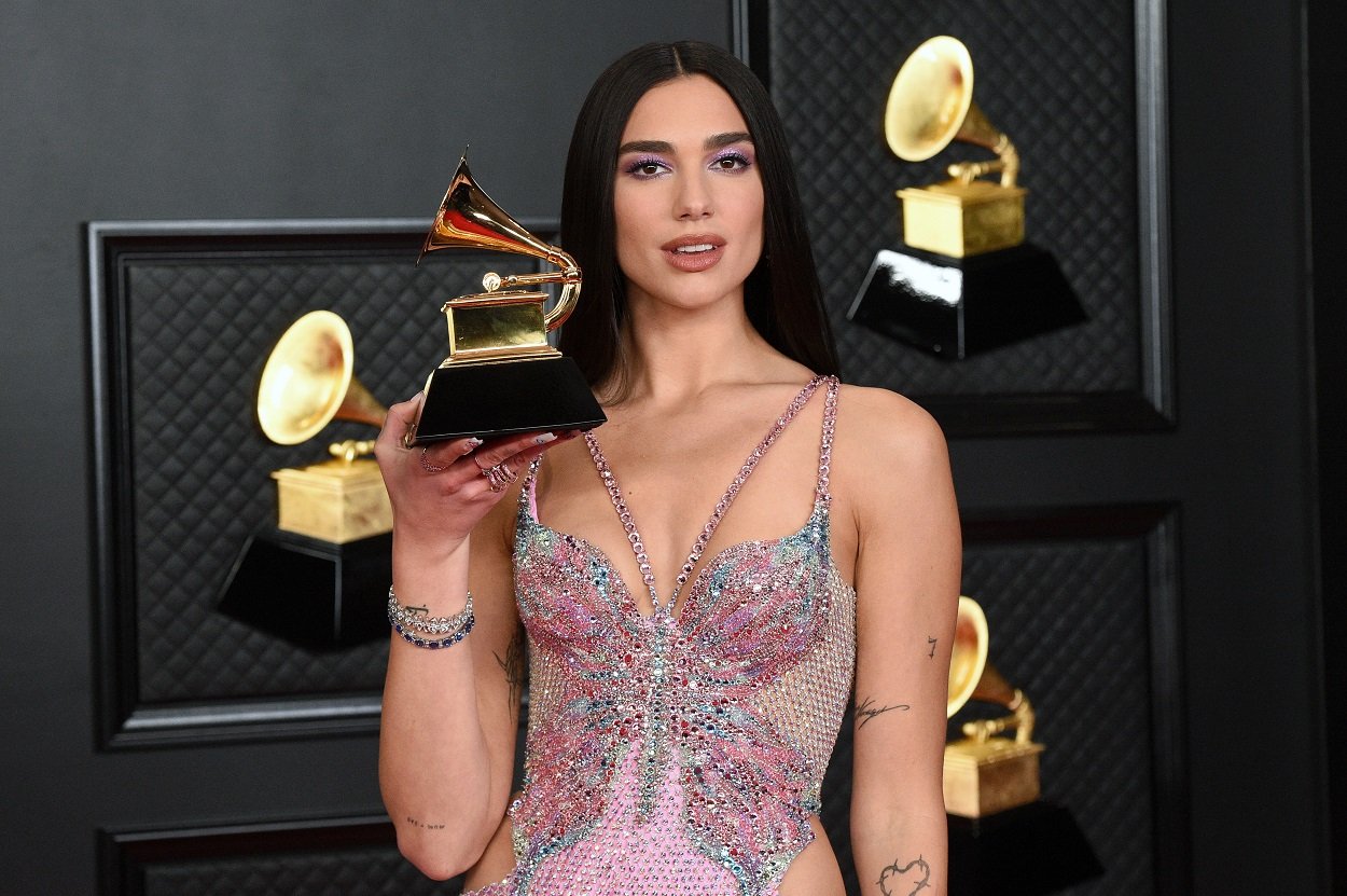 Dua Lipa shows off her Grammy Award after winning for Future Nostalgia