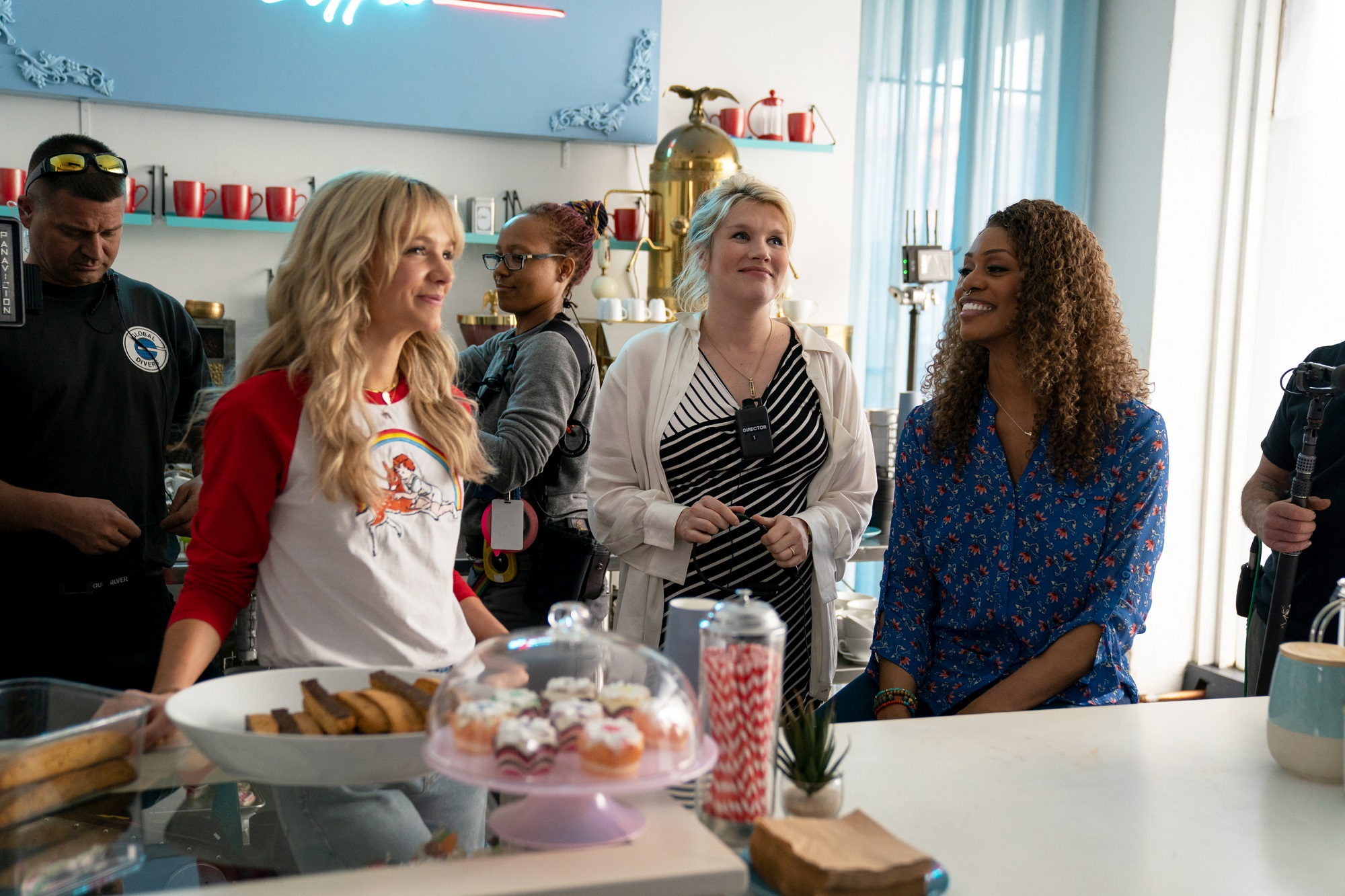 Emerald Fennell directing Carey Mulligan and Laverne Cox in the coffee shop