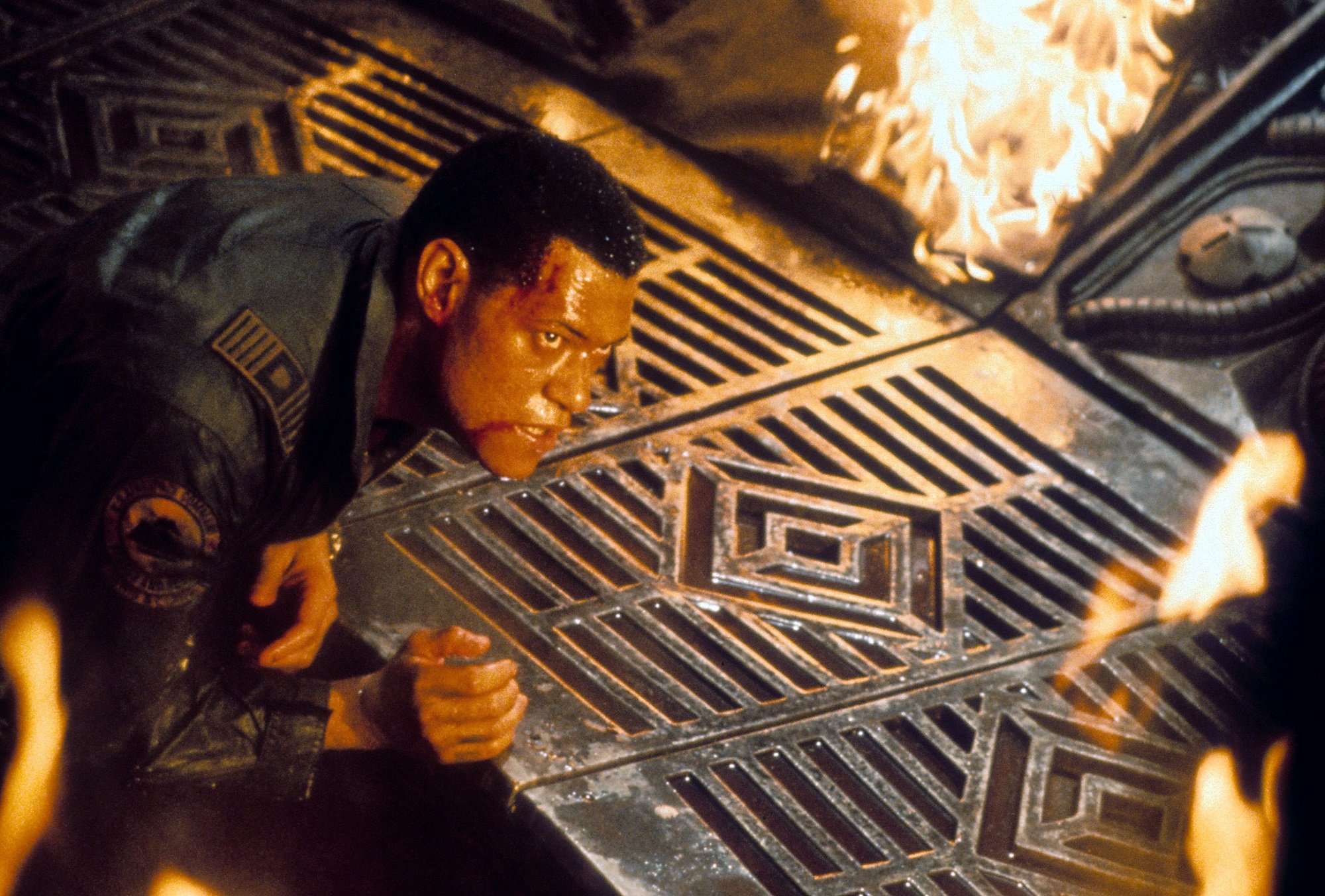 Event Horizon star Laurence Fishburne on the floor of a spaceship