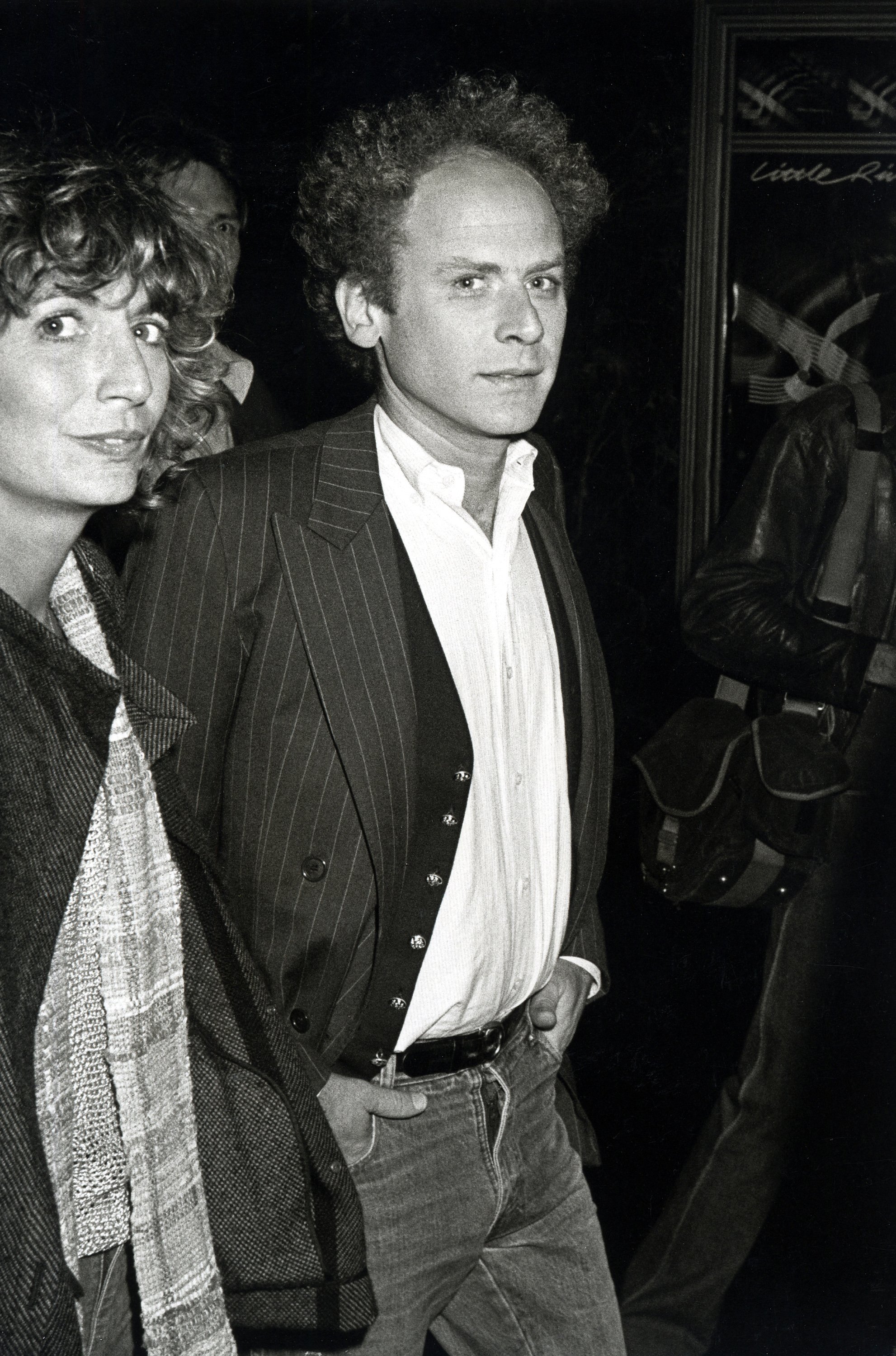 A black and white photograph of actor Penny Marshall with musical artist Art Garfunkel