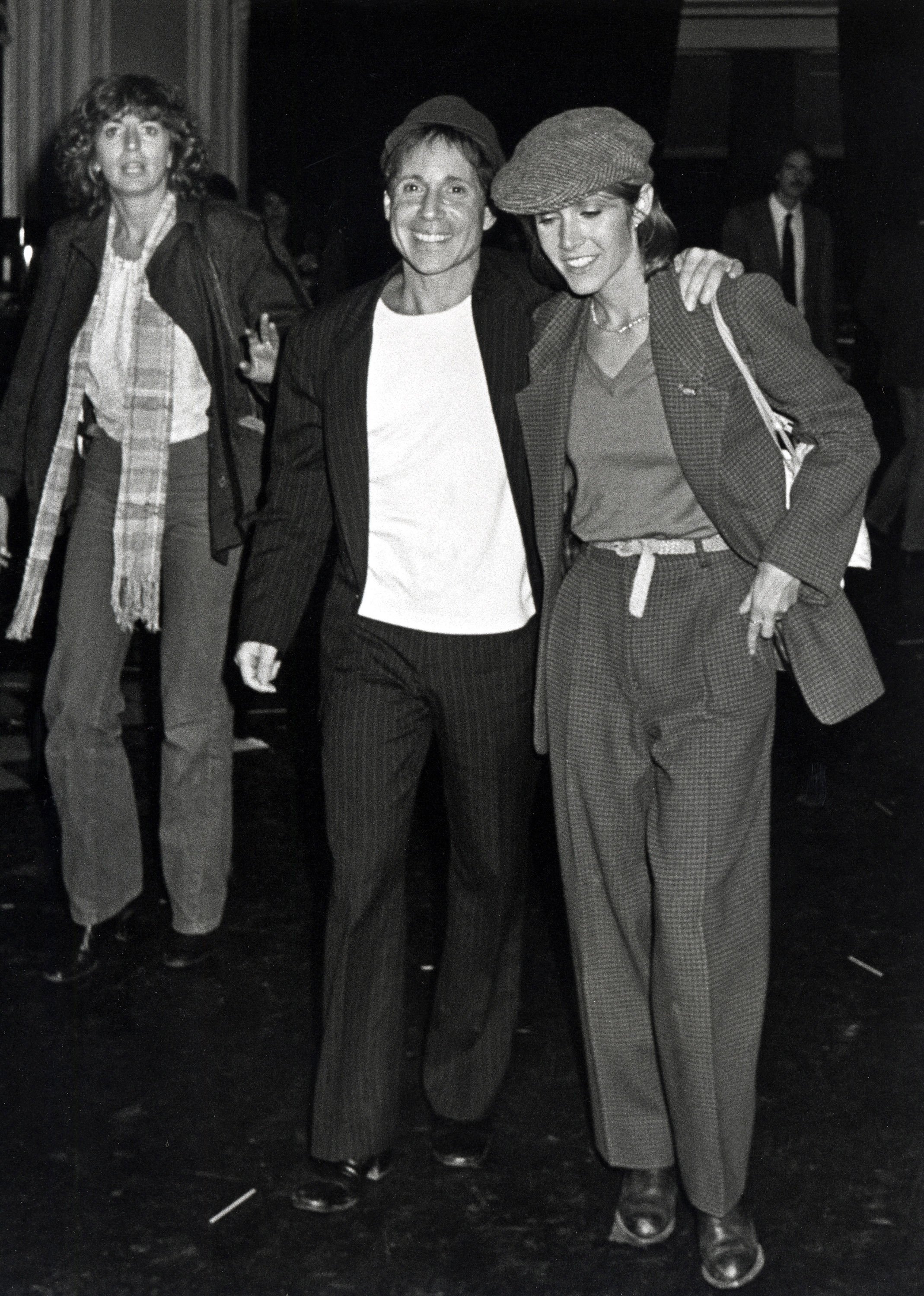 (L to R): Penny Marshall, Paul Simon, and Carrie Fisher in New York City