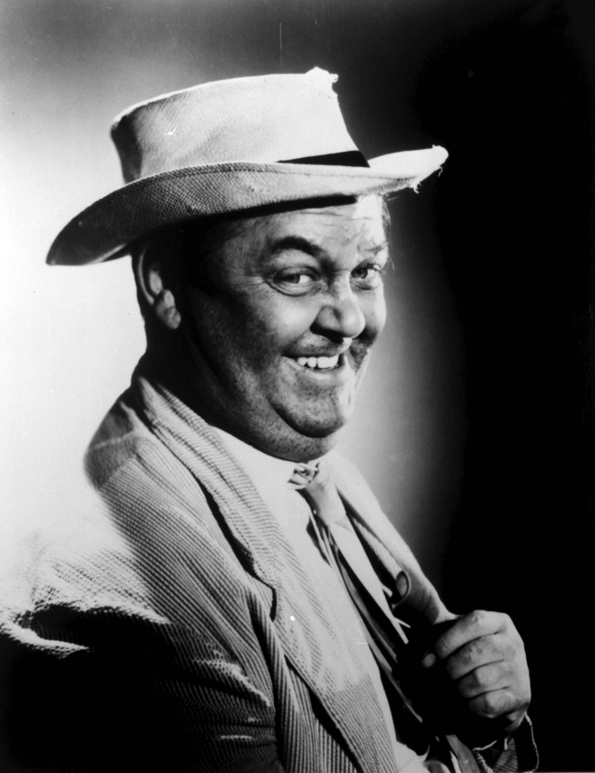 Actor Hal Smith wearing hat and smiling as Otis Campbell on 'The Andy Griffith Show,' 1960
