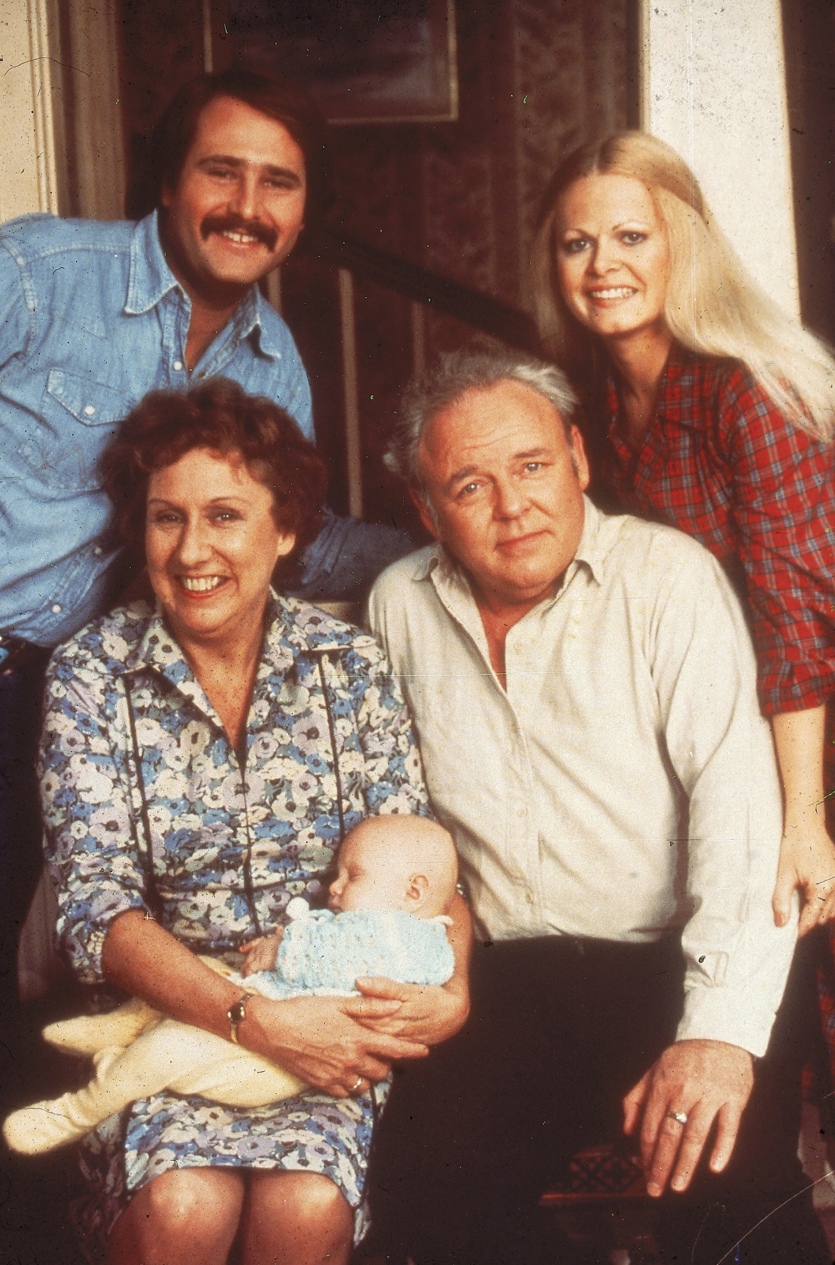 Carroll O'Connor, Jean Stapleton holding Corey M Miller, Rob Reiner and Sally Struthers of 'All in the Family'