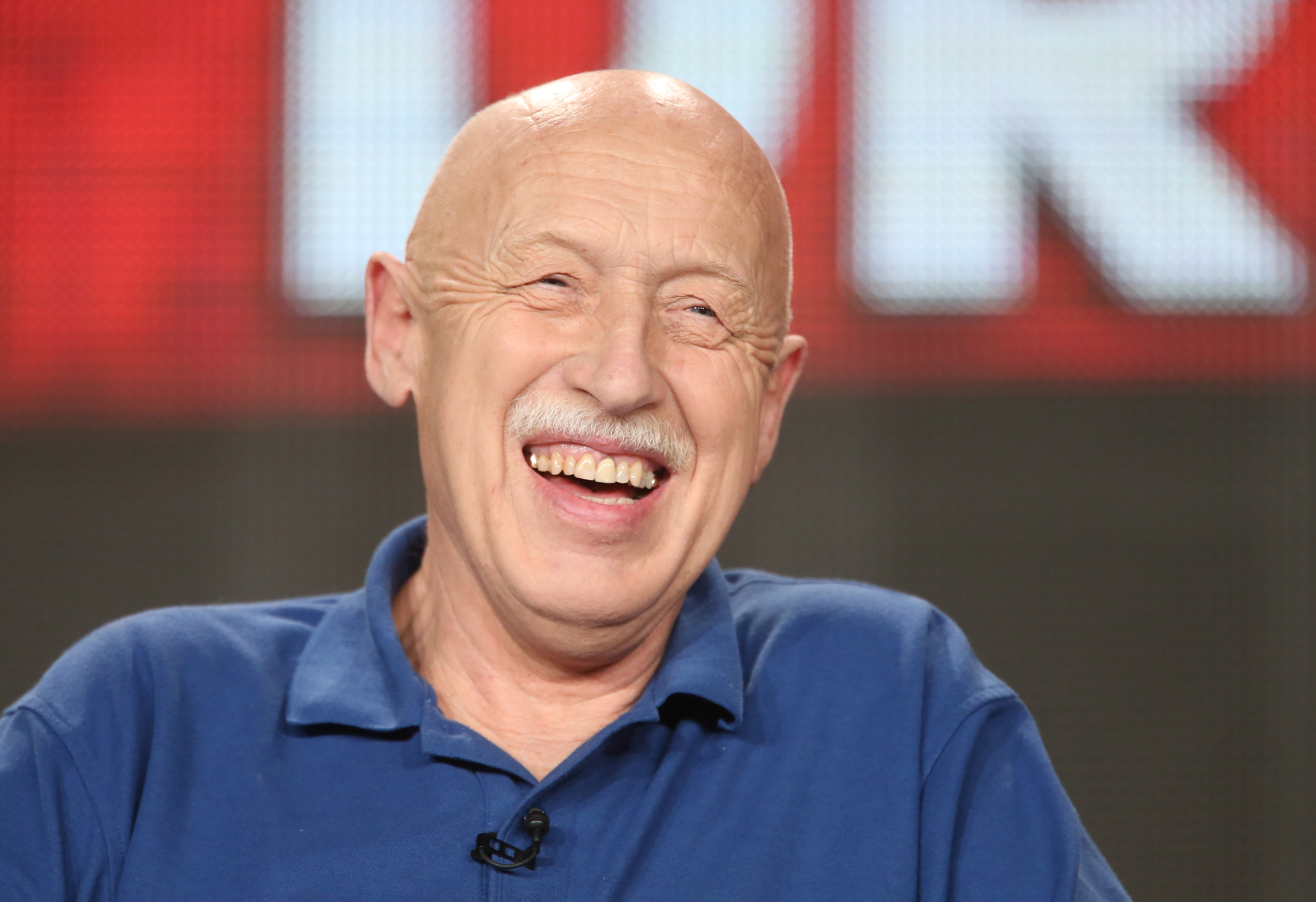 'The Incredible Dr. Pol' star Dr. Jan Pol is shown laughing during a publicity event