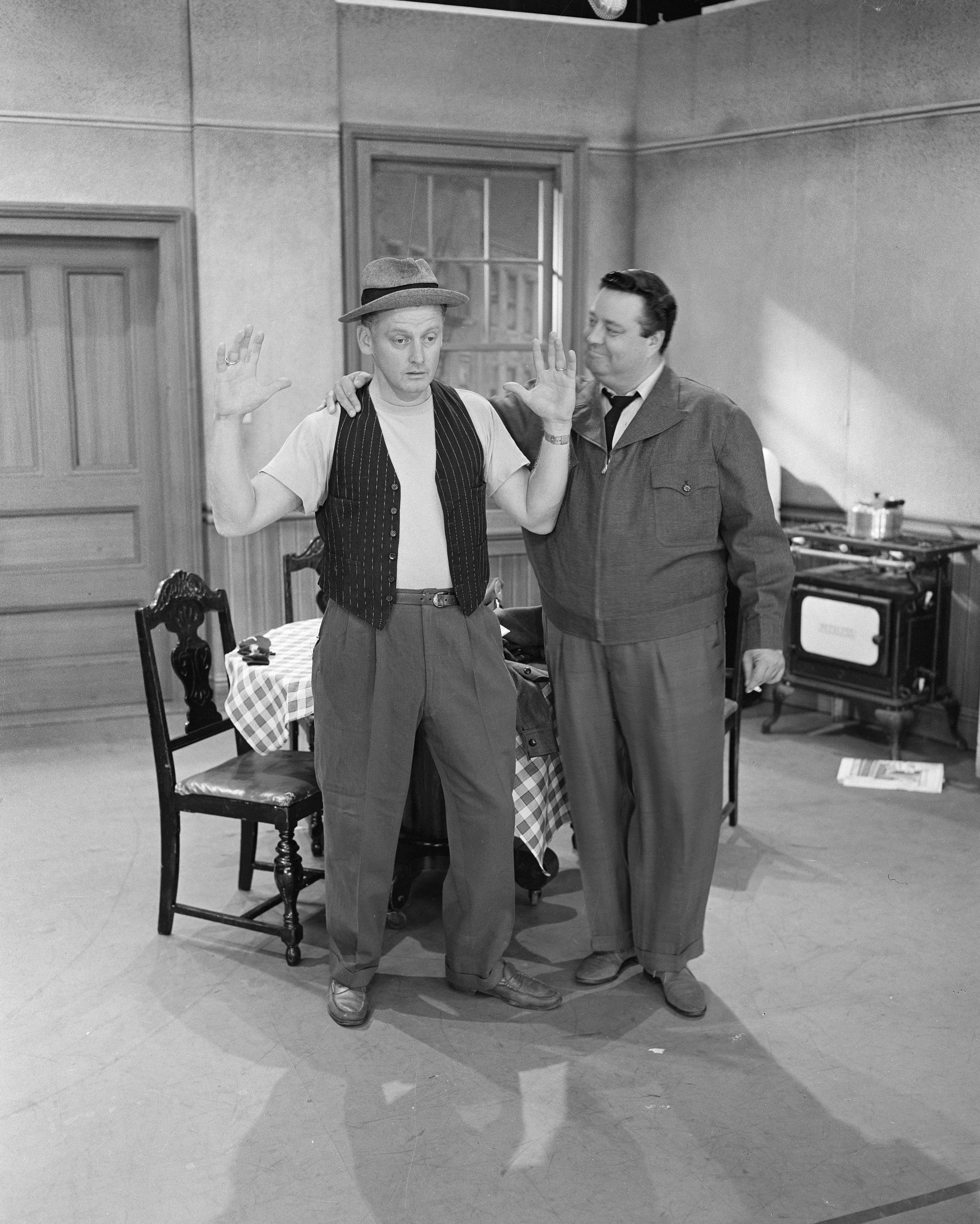 Jackie Gleason and Art Carney in a scene from 'The Honeymooners'