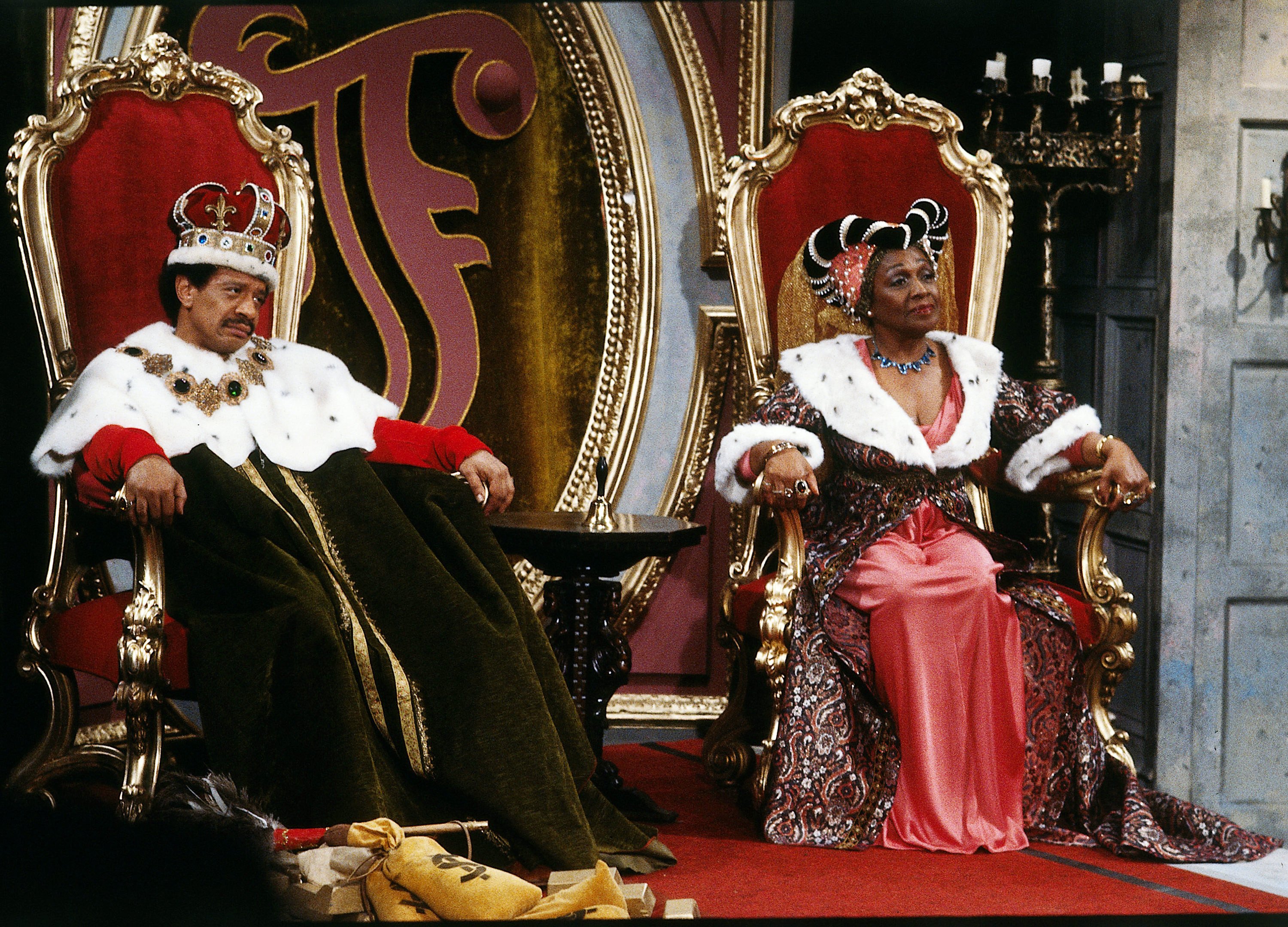 Actors Sherman Hemsley and Isabel Sanford play George and Louise Jefferson dressed up as a king and queen in a scene from the sitcom 'The Jeffersons,' 1975.