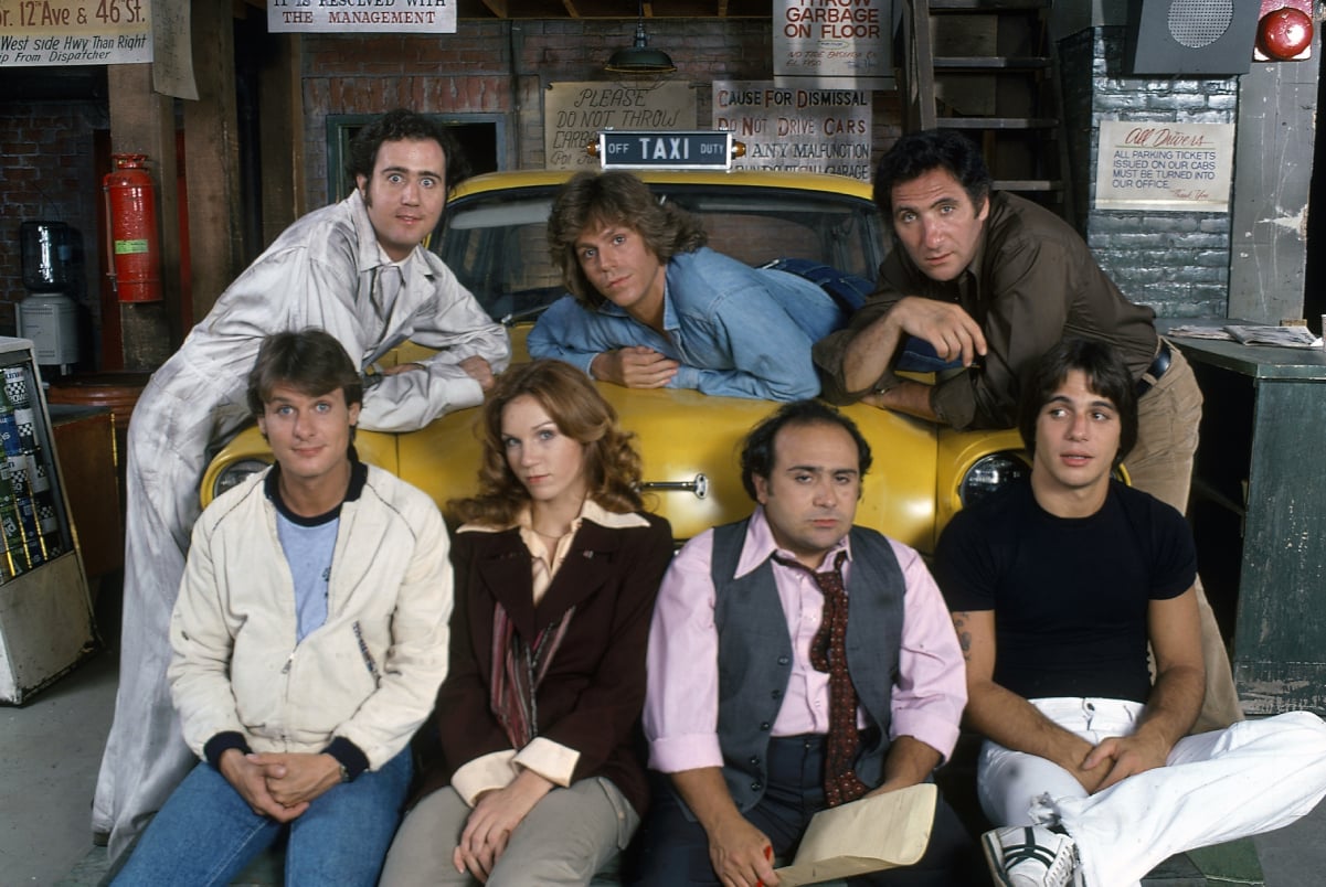 The cast of 'Taxi': (back row L to R): Andy Kaufman (as Latka Gravas), Jeff Conaway (as Bobby Wheeler), and Judd Hirsch (as Alex Reiger) (front row L to R): Randall Carver (as John Burns), Marilu Henner (as Elaine Nardo), Danny DeVito (as Louie De Palma), and Tony Danza (as Tony Banta)