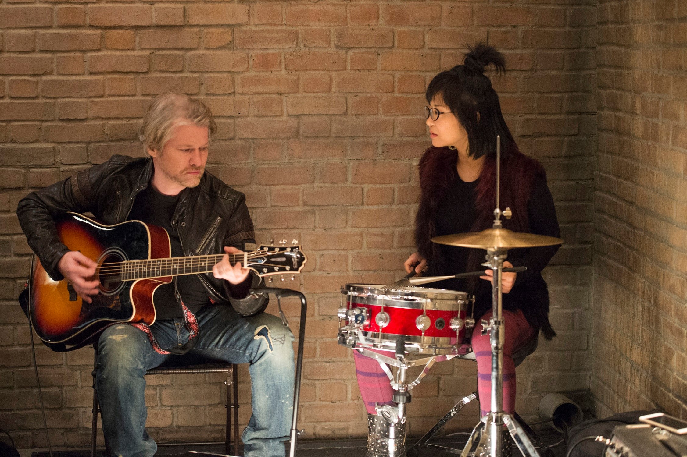 Todd Lowe plays guitar while Keiko Agena plays drums on 'Gilmore Girls: A Year in the Life'