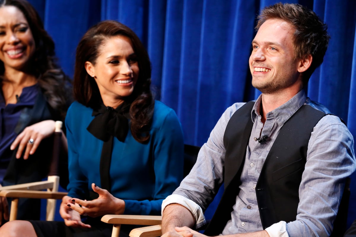Gina Torres, Meghan Markle, Patrick J. Adams smile at a panel and screening for Suits