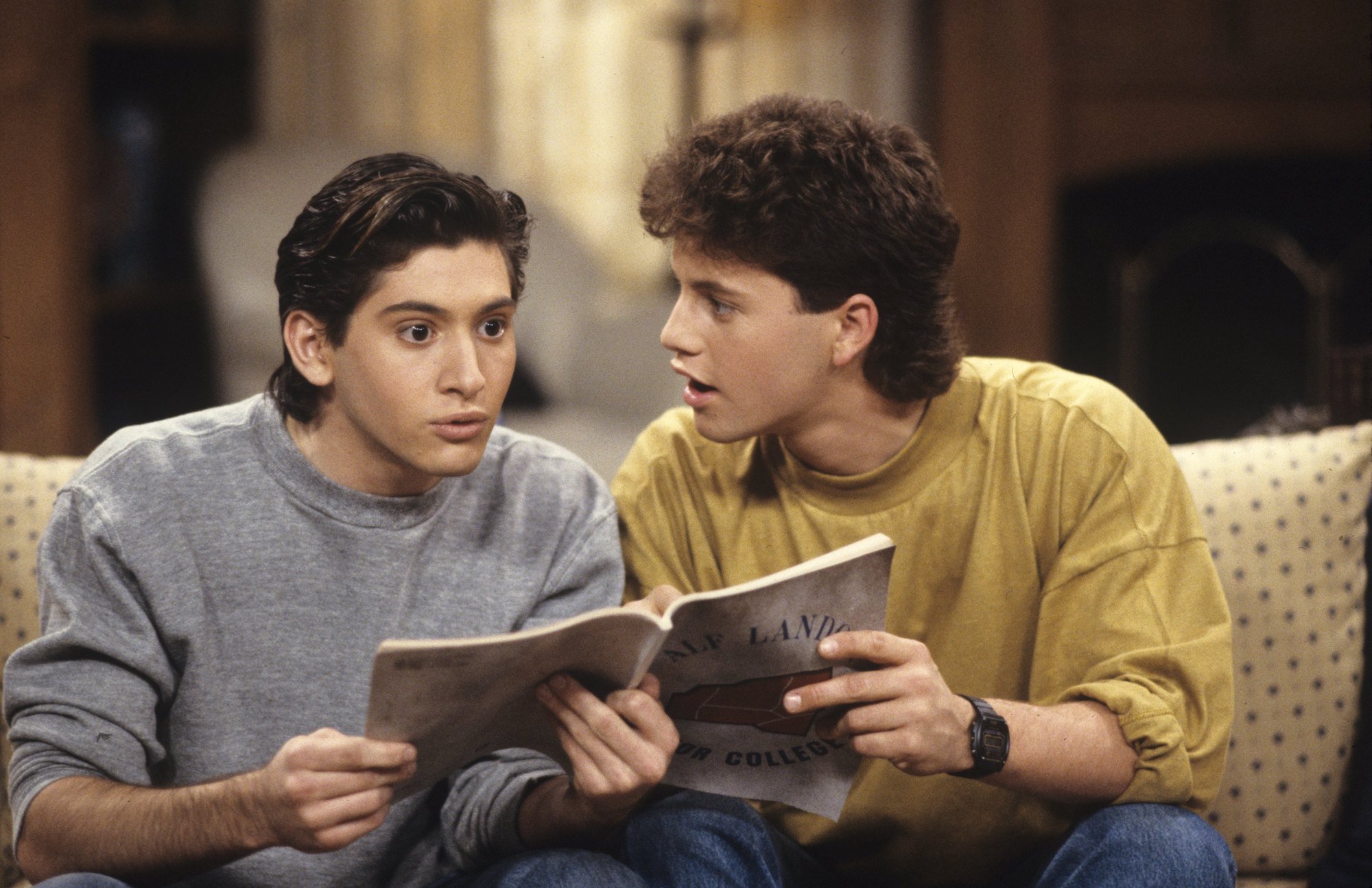 (L-R) Andrew Koenig and Kirk Cameron on 'Growing Pains' sitting on a couch