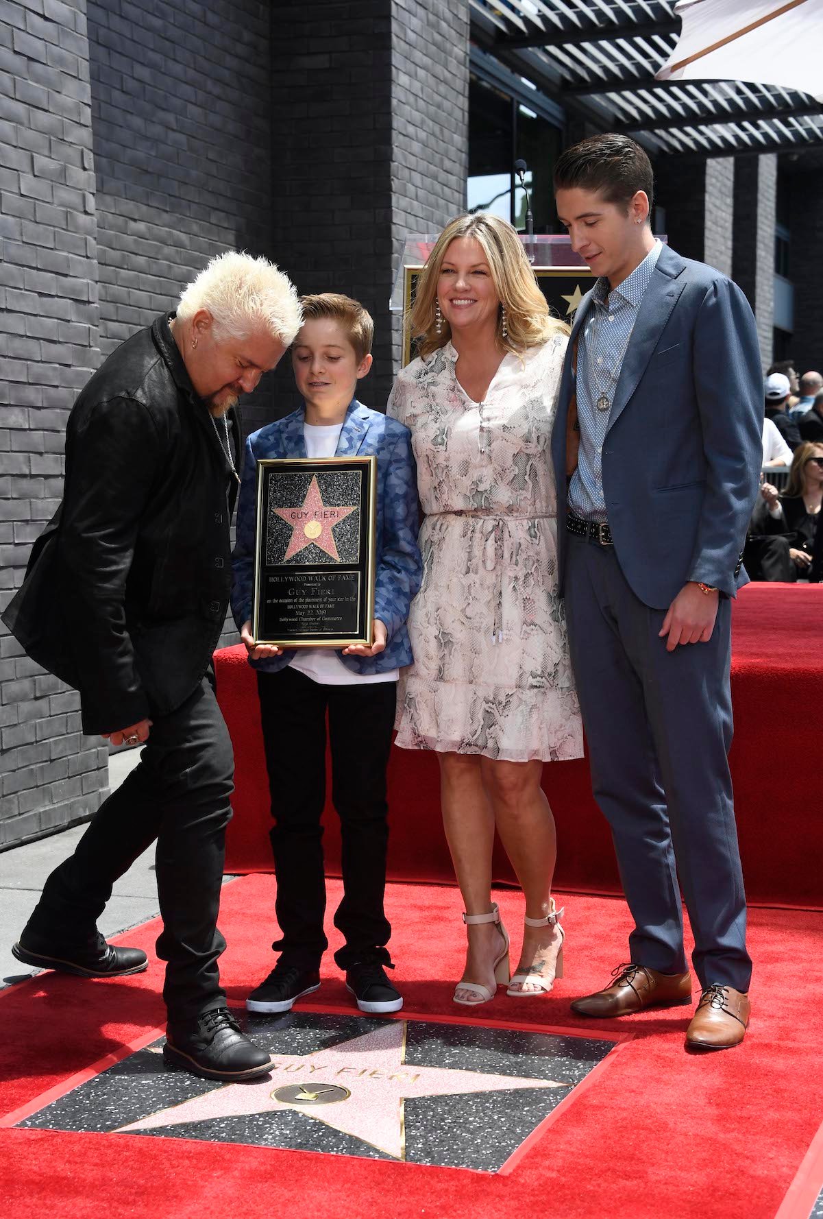 Guy Fieri, his wife, Lori, and two kids, Hunter and Ryder, attend his Hollywood Walk of Fame ceremony in 2019. 