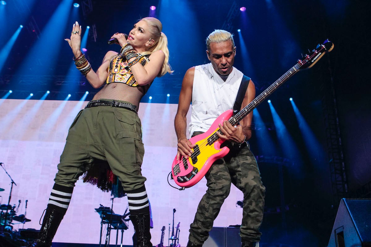 Gwen Stefani sings and Tony Kanal of No Doubt plays bass on stage