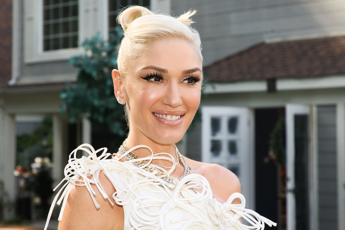 Gwen Stefani visits Hallmark Channel's "Home & Family" smiling in a white feather dress