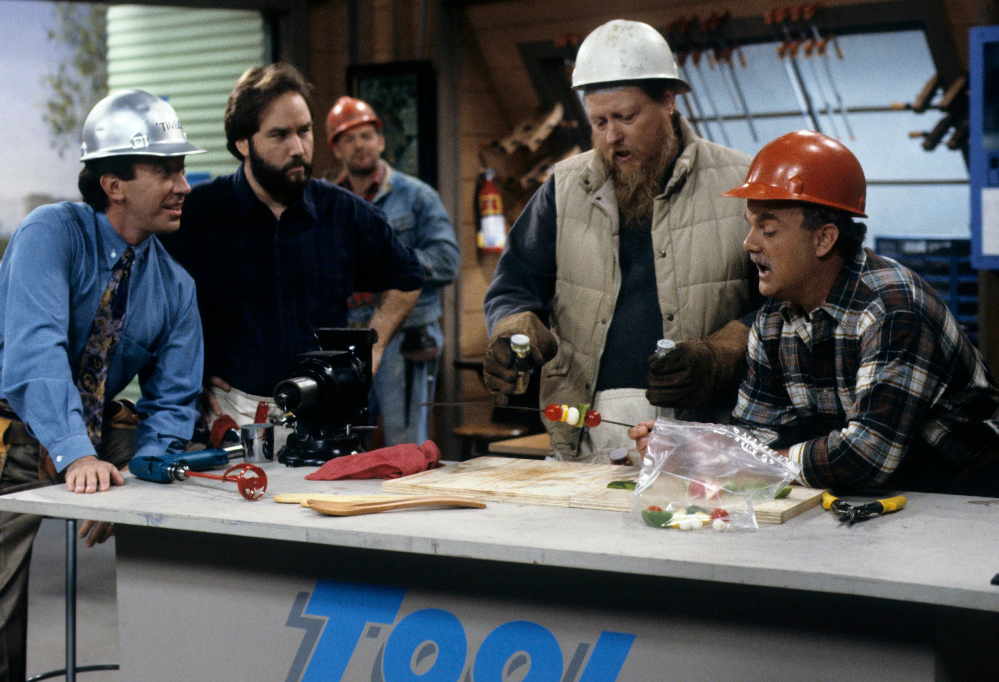 (L-R) Tim Allen, Richard Karn, Casey Sander, Mickey Jones, and Gary Mcgurk around a work table