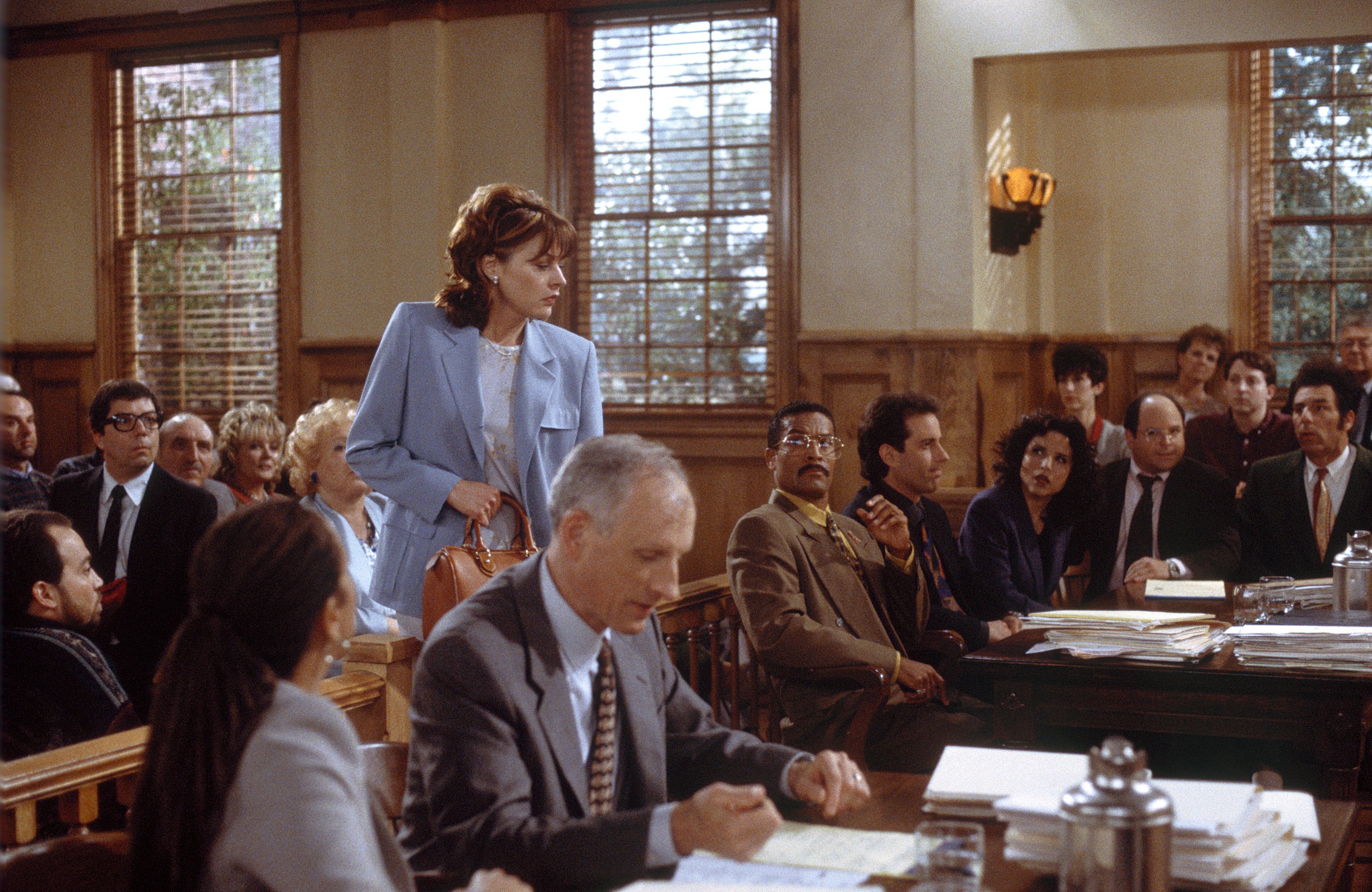 Marla Penny, along side D.A. Hoyt, Jackie Chiles, Jerry, Elaine Benes, George Costanza and Cosmo Kramer in a courthouse scene from the final episode of 'Seinfeld' in 1998