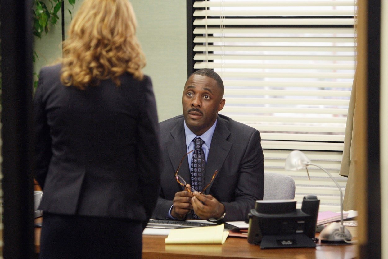 Jenna Fischer as Pam Beesly and Idris Elba as Charles Miner filming an episode of The Office