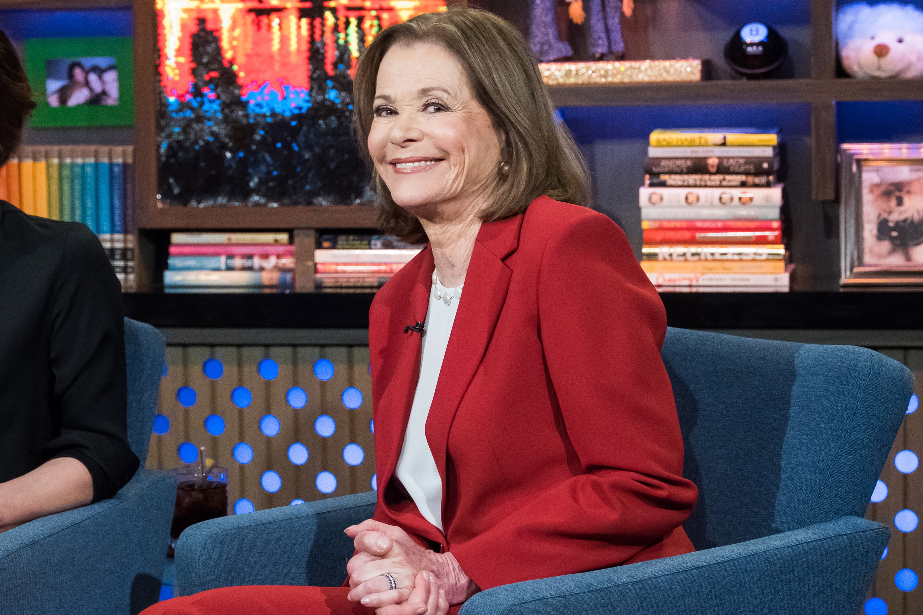 Jessica Walter sits in a blue chair