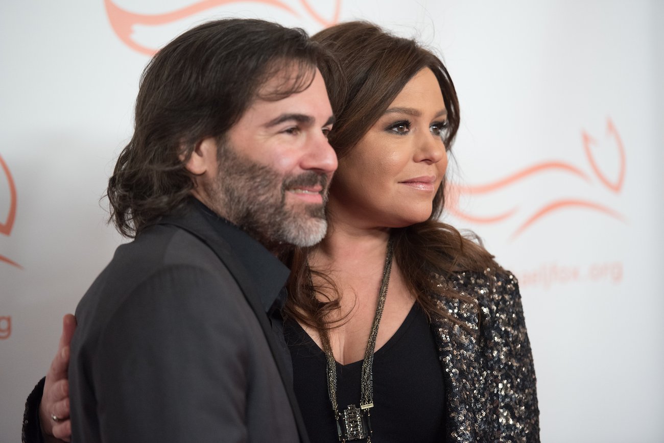 John Cusimano and Rachael Ray, both in dark attire, smile for a picture while attend the Michael J. Fox Foundation's 'A Funny Thing Happened On The Way To Cure Parkinson's' Gala at The Waldorf Astoria