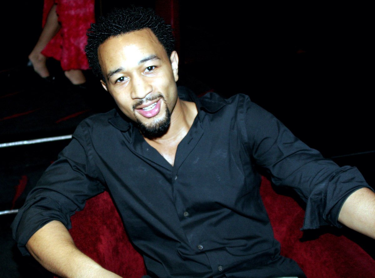 John Legend smiling in a black shirt in 2005 | Johnny Nunez/WireImage