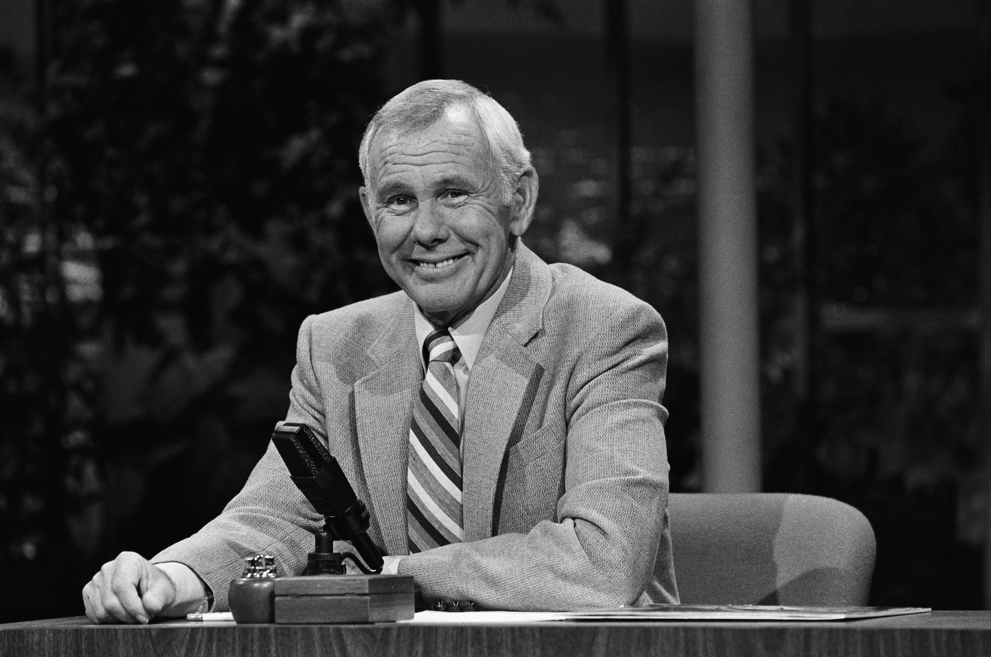 Johnny Carson sitting at a desk on 'The Tonight Show'
