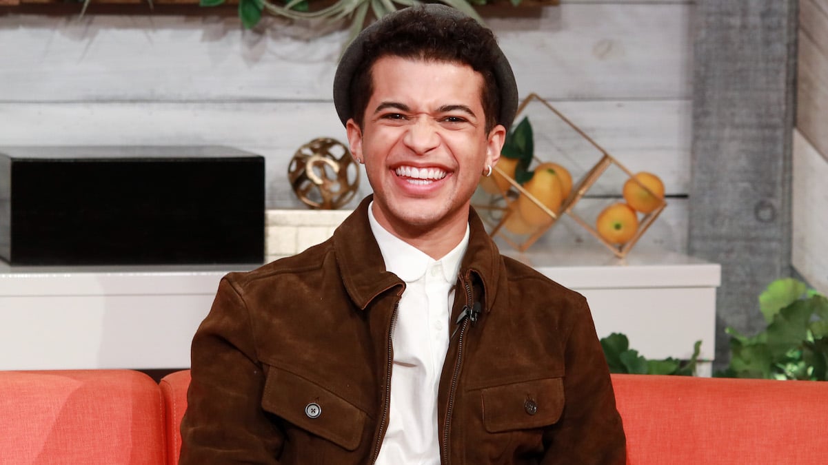 Jordan Fisher smiling during an interview