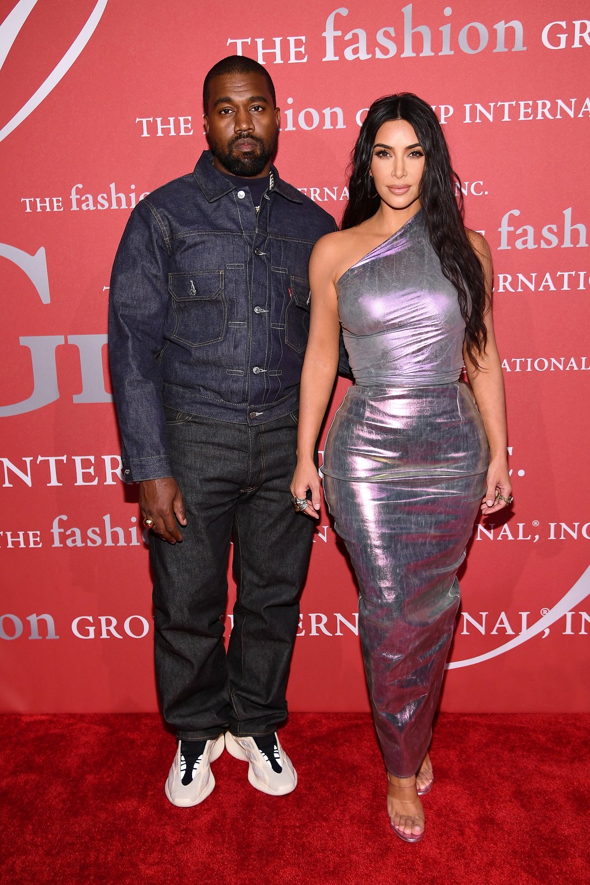 Kanye West and Kim Kardashian stand together on red carpet for photos at the 2019 FGI Night of Stars Gala