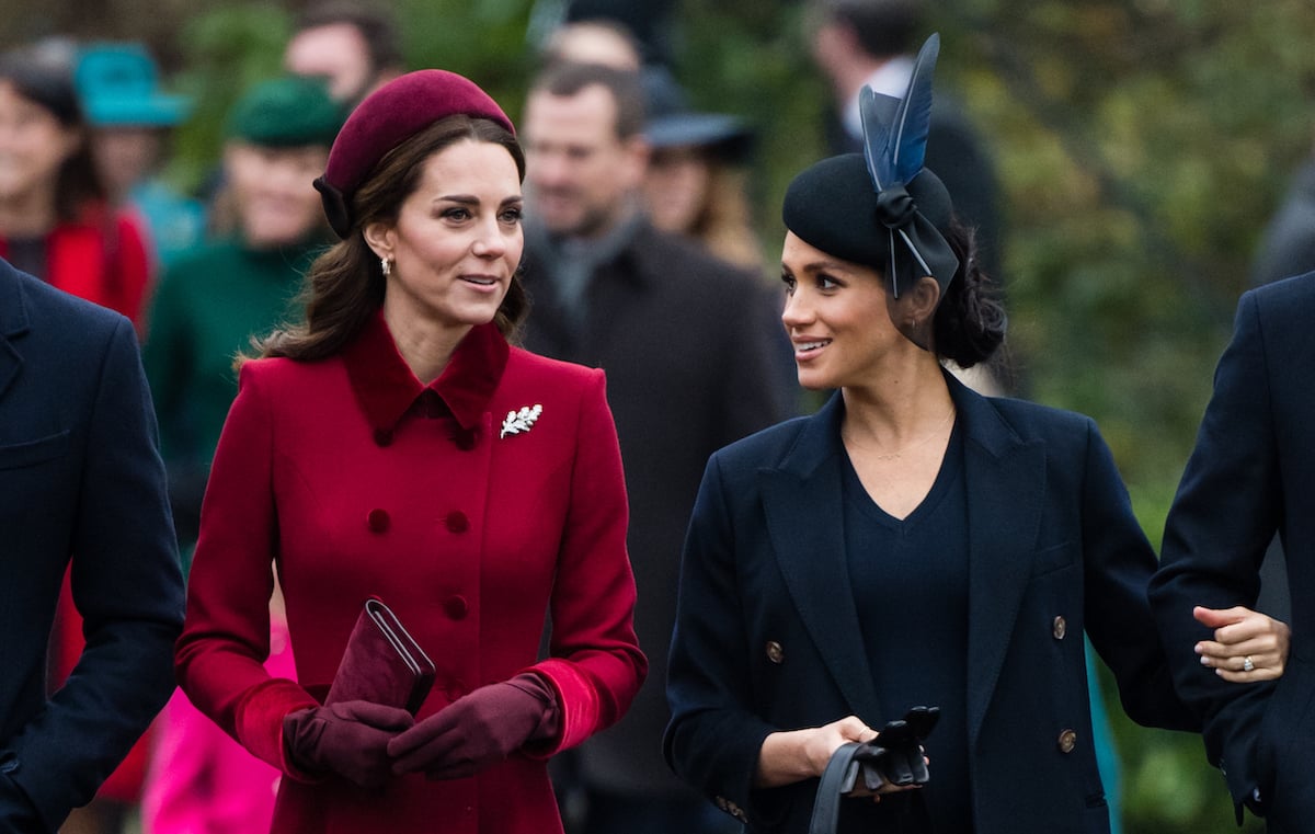 Kate Middleton and Meghan Markle walk together as they attend church on Christmas Day in 2018