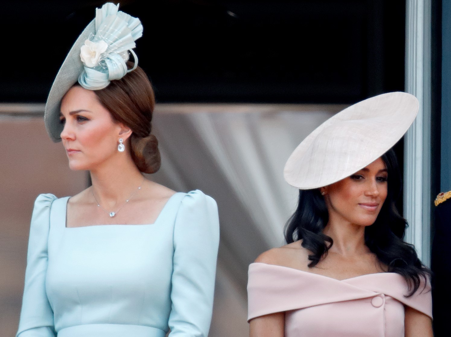 Kate Middleton and Meghan Markle stand nect to each other on the balcony of Buckingham Palace during Trooping The Colour 2018