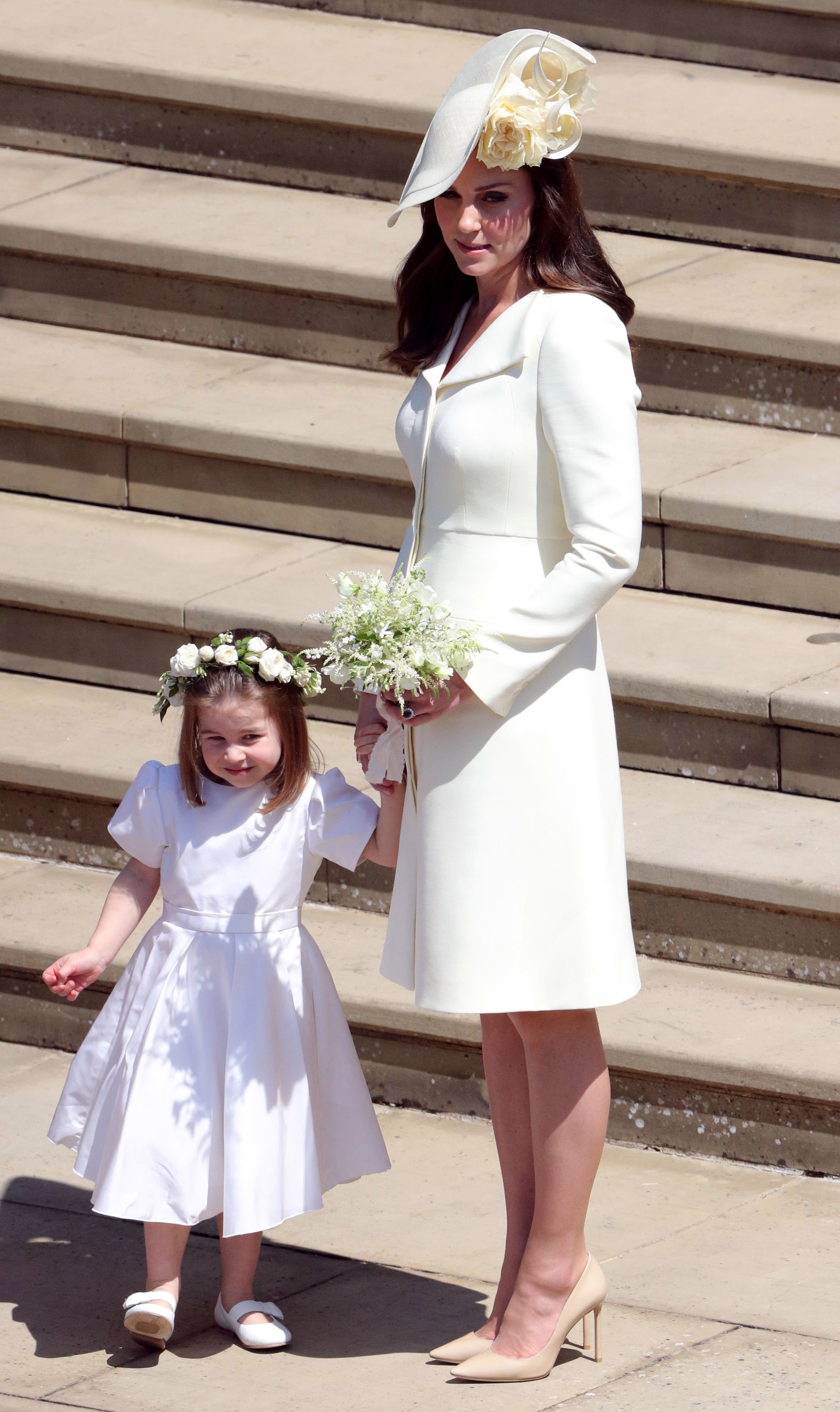 Kate Middleton holding Princess Charlotte's hand outside of St George's Chapel after Prince Harry and Meghan Markle's wedding