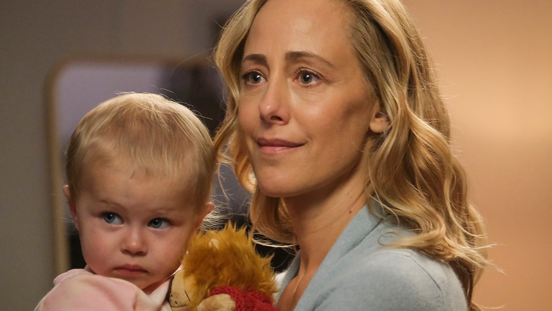 Kim Raver as Teddy Altman holding Allison, her baby with Owen Hunt (Kevin McKidd), in ‘Grey’s Anatomy’ Season 17 Episode 9.
