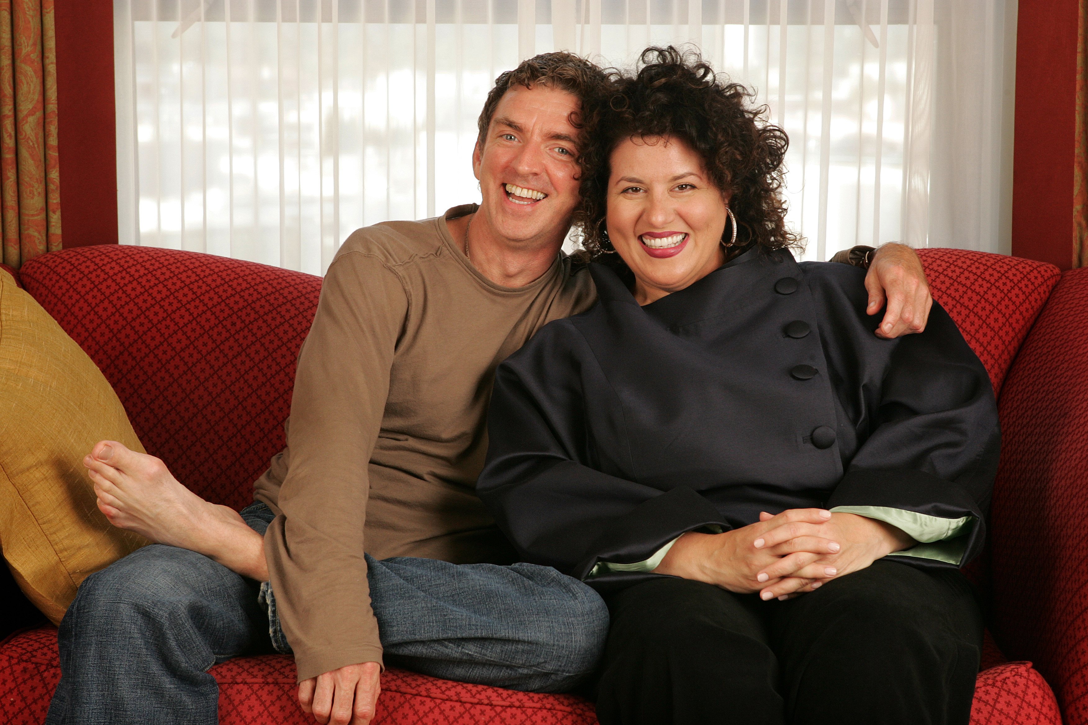 Michael Patrick King and r Adriana Trigiani pose for a photograph at the Regent Beverly Wilshire Hotel on August 18, 2005 in Beverly Hills, California