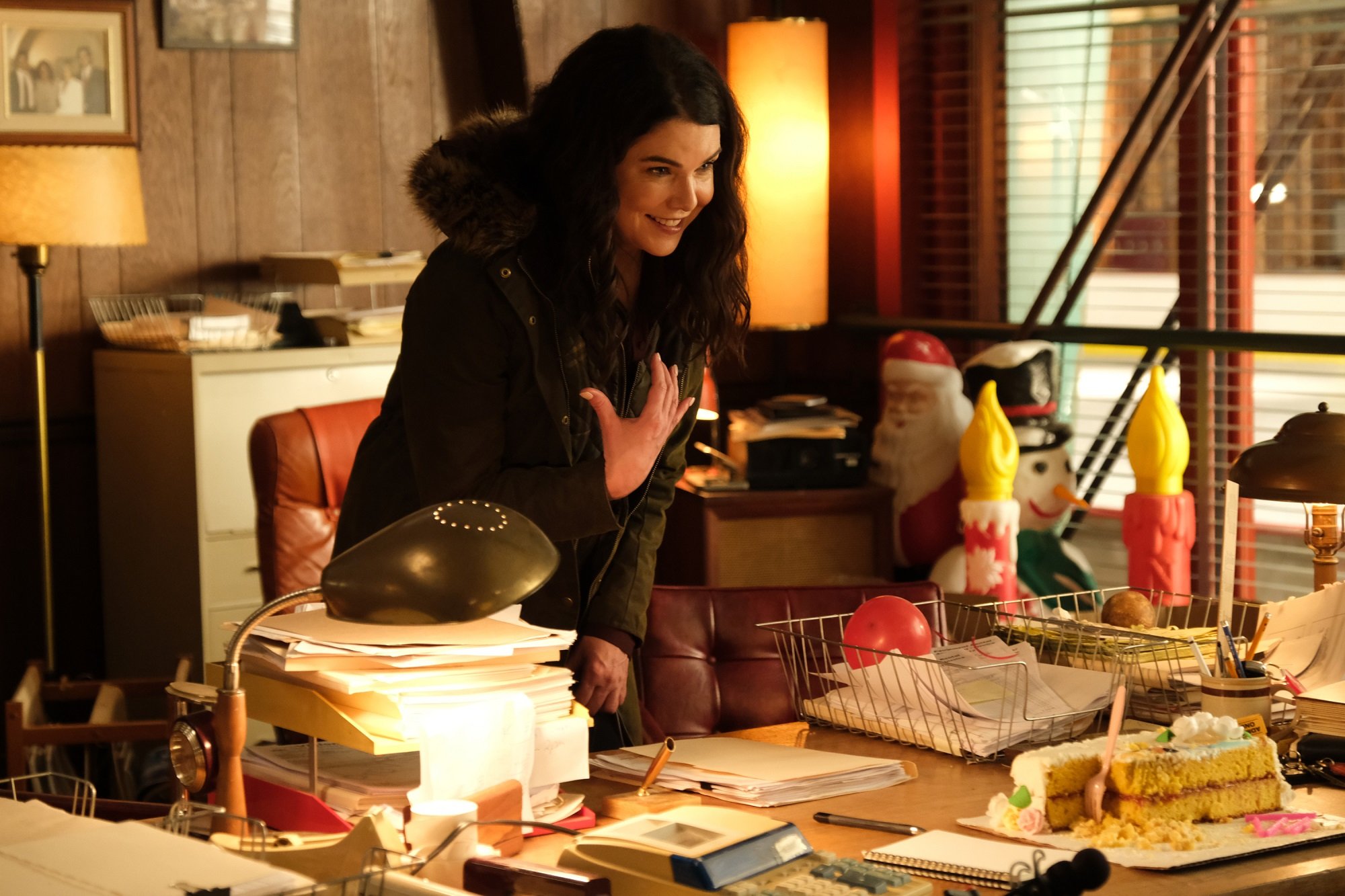 Lauren Graham stands in front of a desk in Gordon Bombay's office on 'The Mighty Ducks: Game Changers'