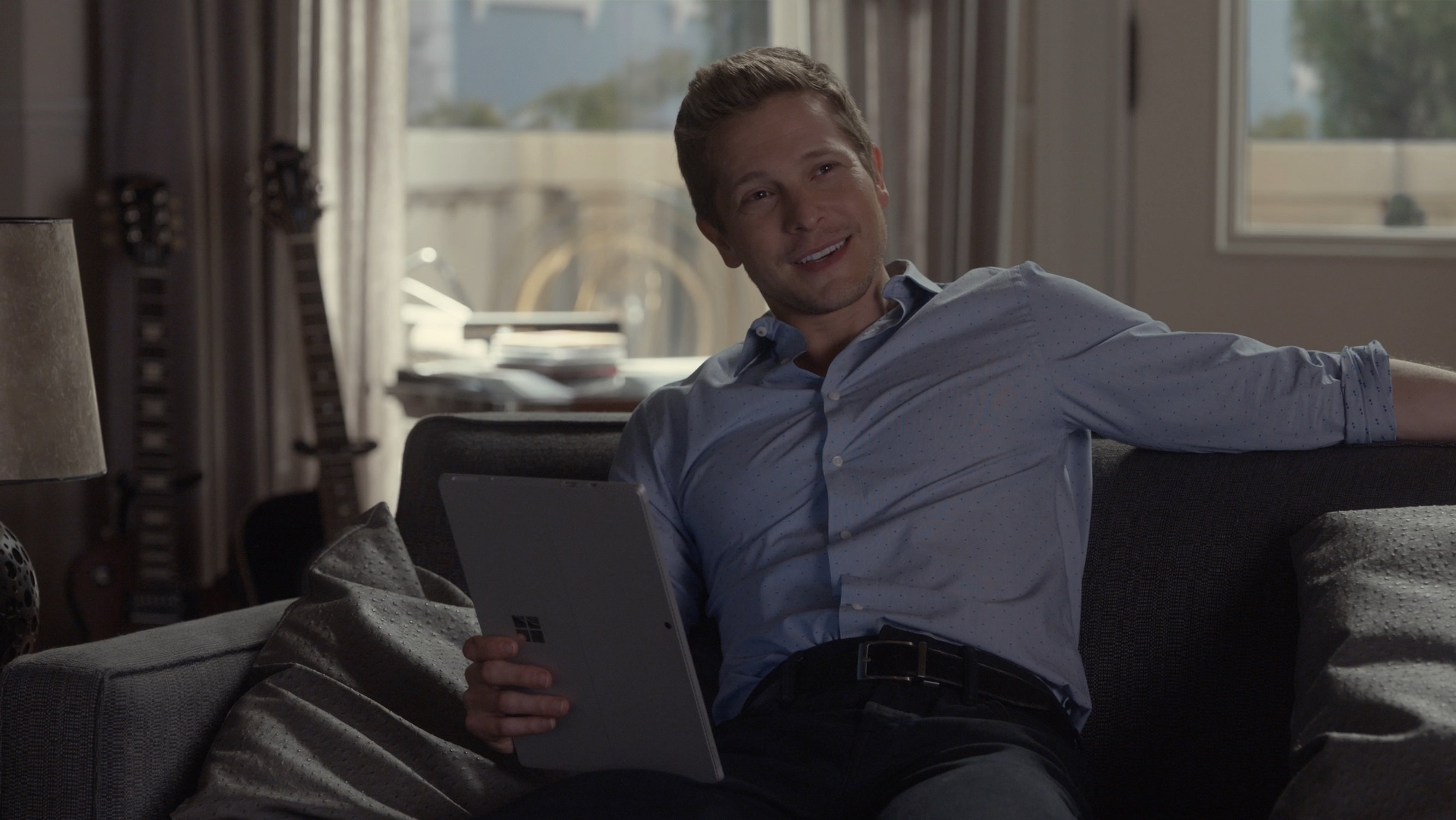 Matt Czuchry as Logan Huntzberger sits on the couch in a scene from 'Gilmore Girls: A Year in the Life'