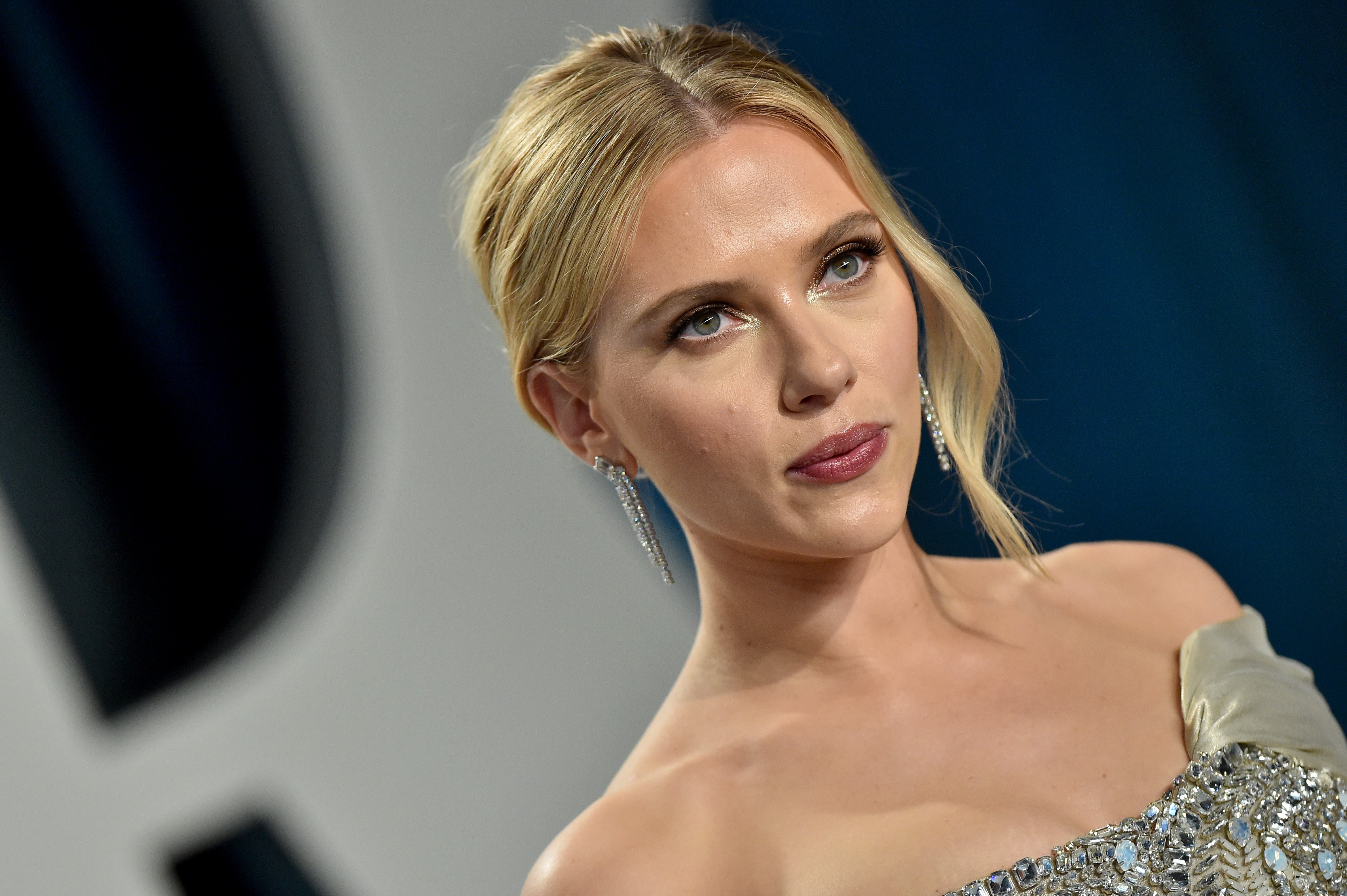 Scarlett Johansson poses for cameras with her hair up as she attends the 2020 Vanity Fair Oscar Party hosted by Radhika Jones at Wallis Annenberg Center for the Performing Arts 