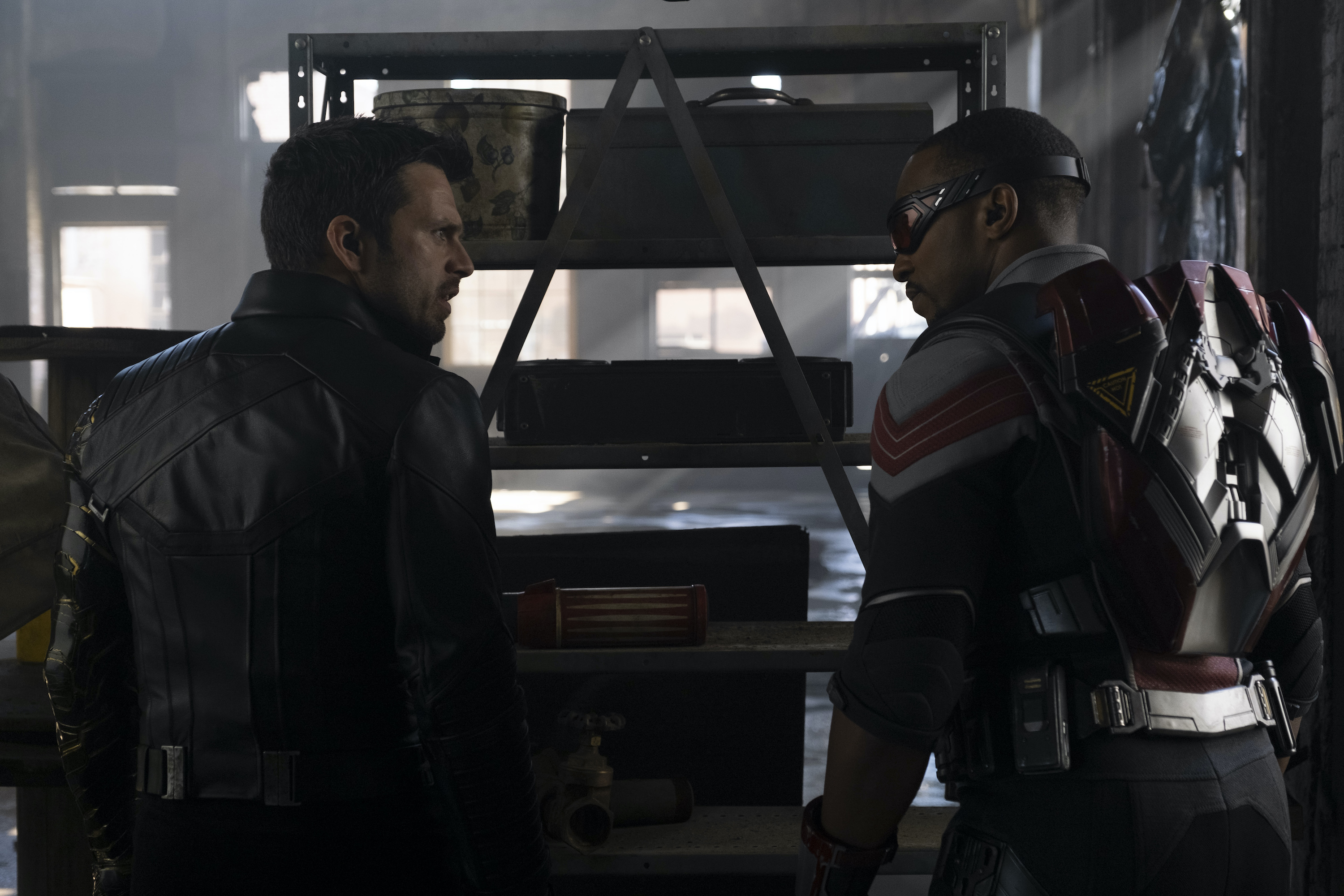 Marvel heroes Winter Soldier and Falcon look at each other on a mission