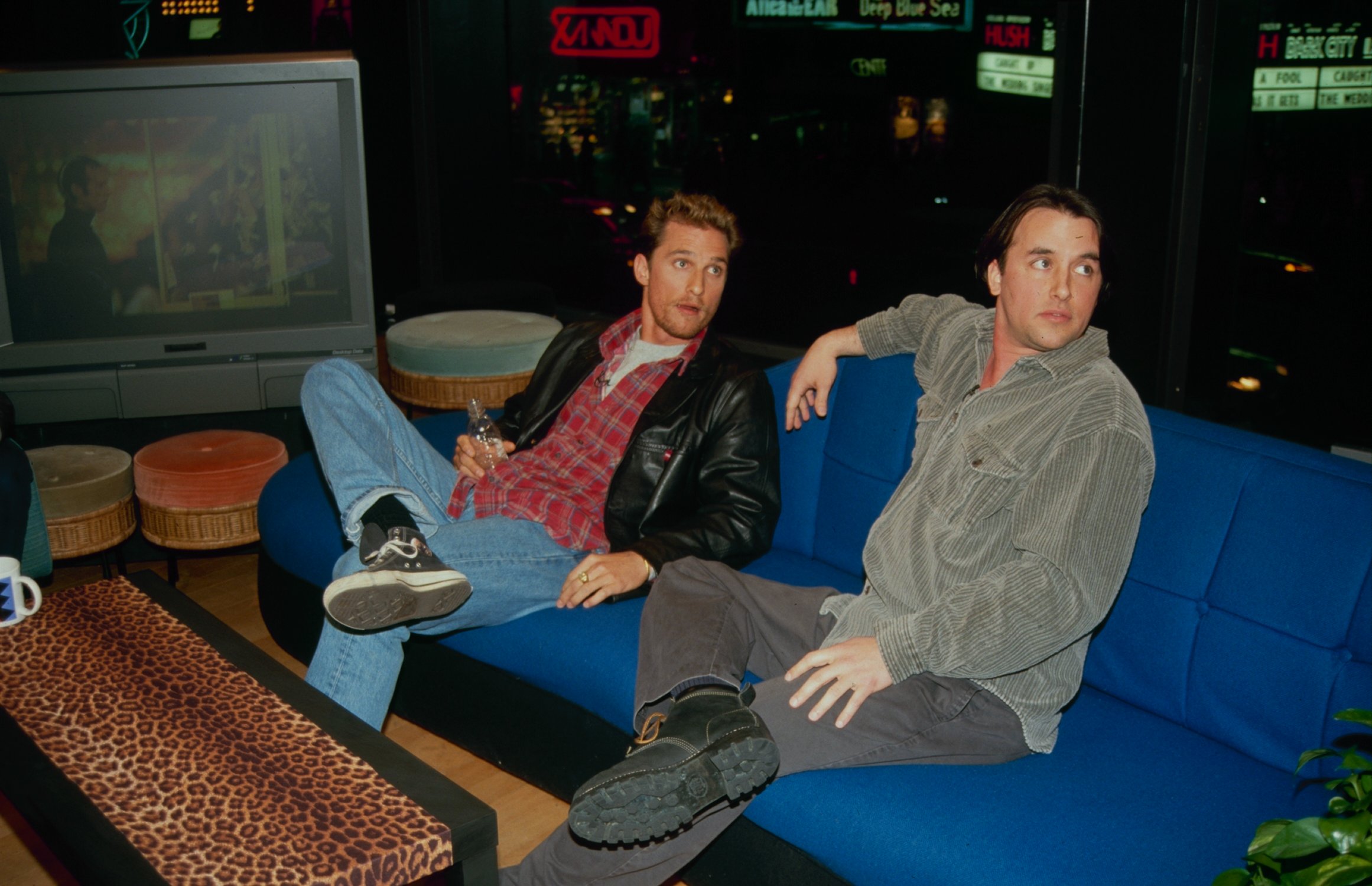 Matthew McConaughey and Richard Linklater sitting on a blue couch