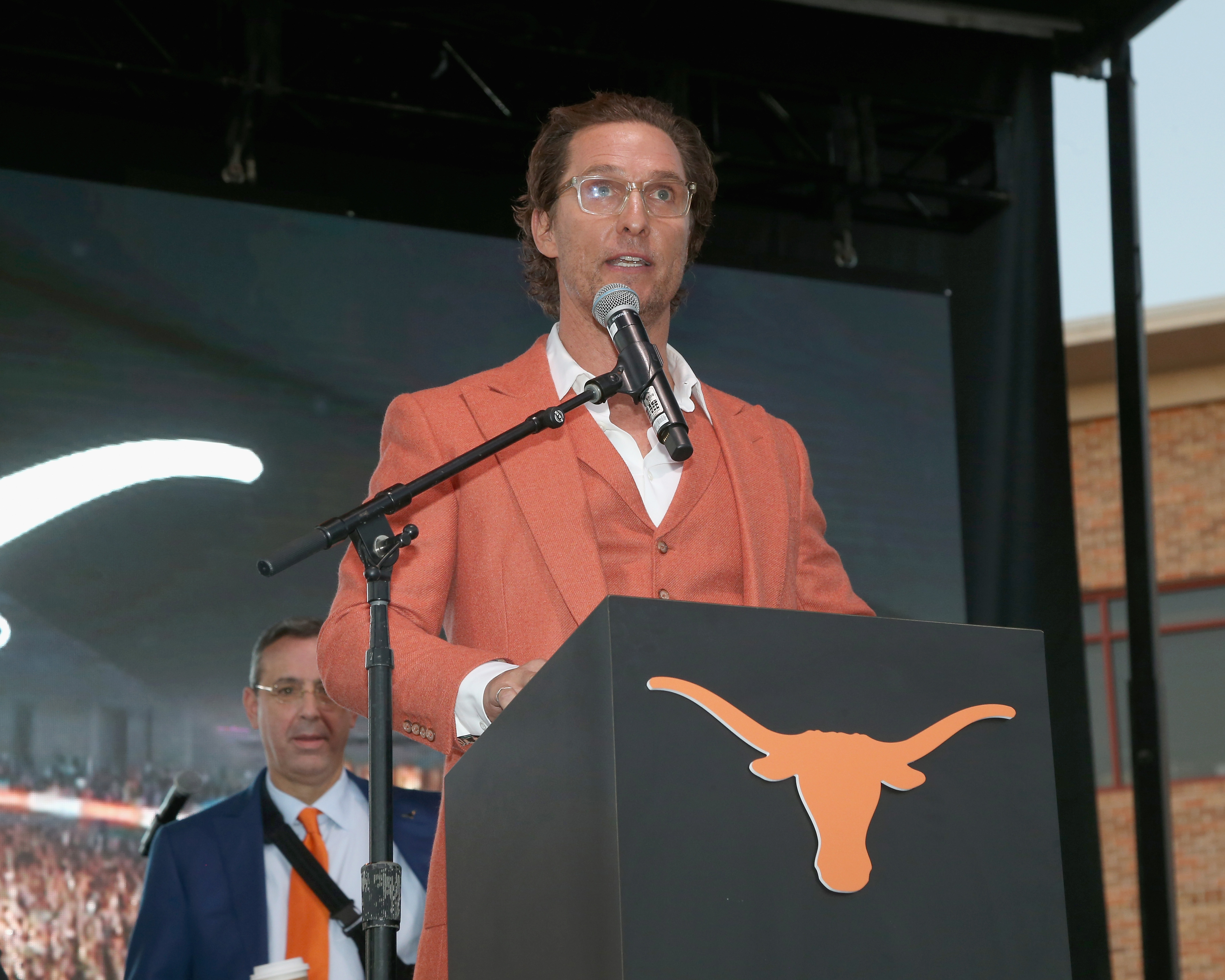 Matthew McConaughey speaks at a podium