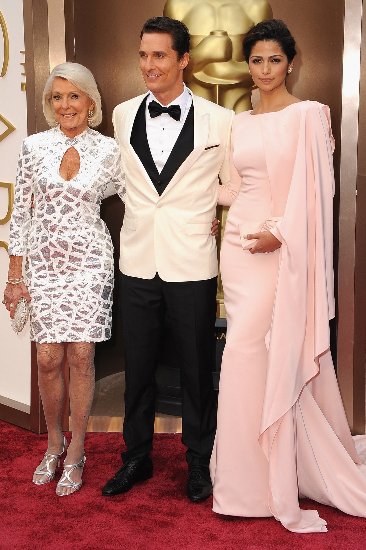 Matthew McConaughey at the 2014 Oscars on the red carpet with his mom, Mary "Kay" McConaughey, and Camila Alves