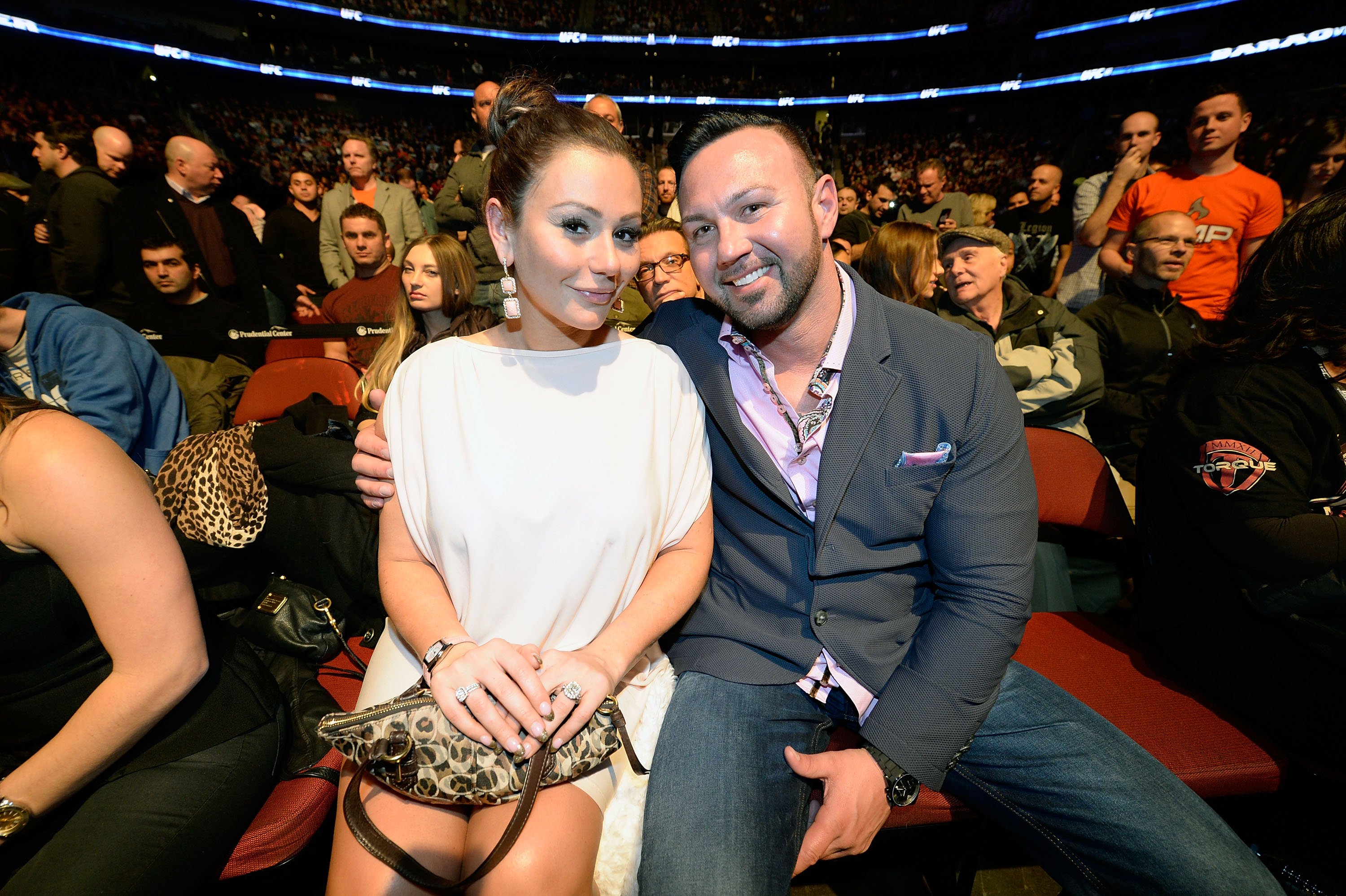 Jenni "JWoww" Farley and Roger Mathews attend the bantamweight championship fight between Renan Barao and Urijah Faber during the UFC 169 event at the Prudential Center on February 1, 2014 