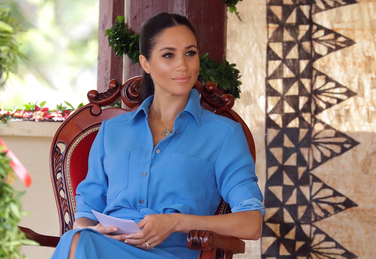 Meghan, Duchess of Sussex smiles during a visit to Tupou College